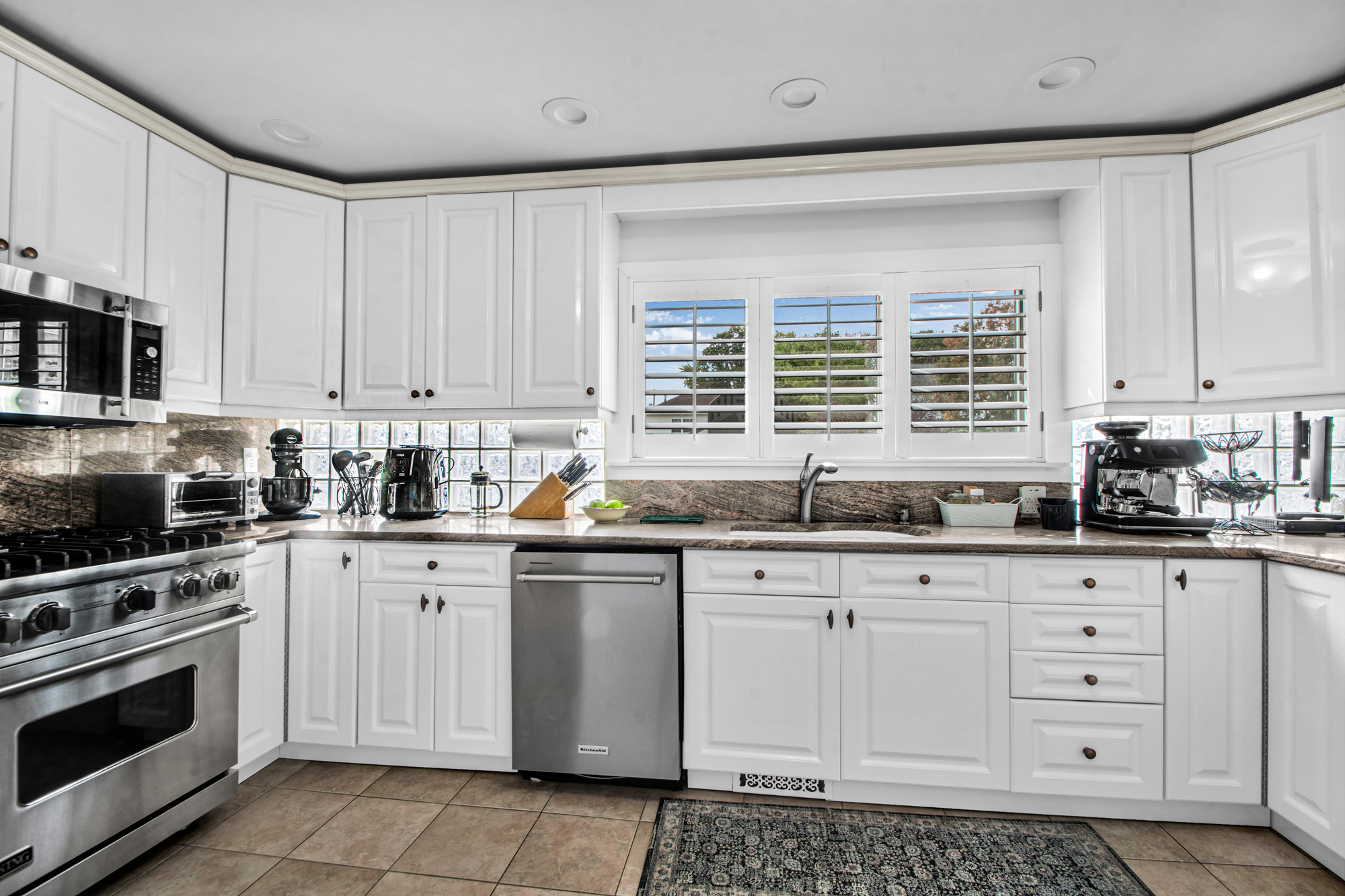 165 Swaim Avenue Staten Island, NY 10312 - Photo 6 of 45 a kitchen with granite countertop white cabinets and appliances