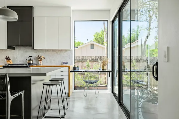 a kitchen with stainless steel appliances granite countertop a stove and a refrigerator