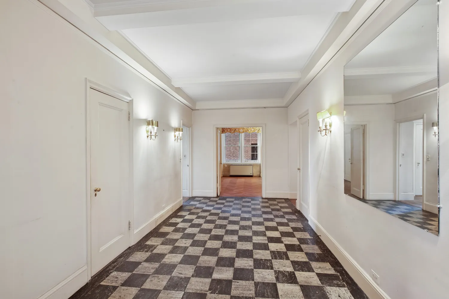 a view of a bathroom with a black and white checkered floor