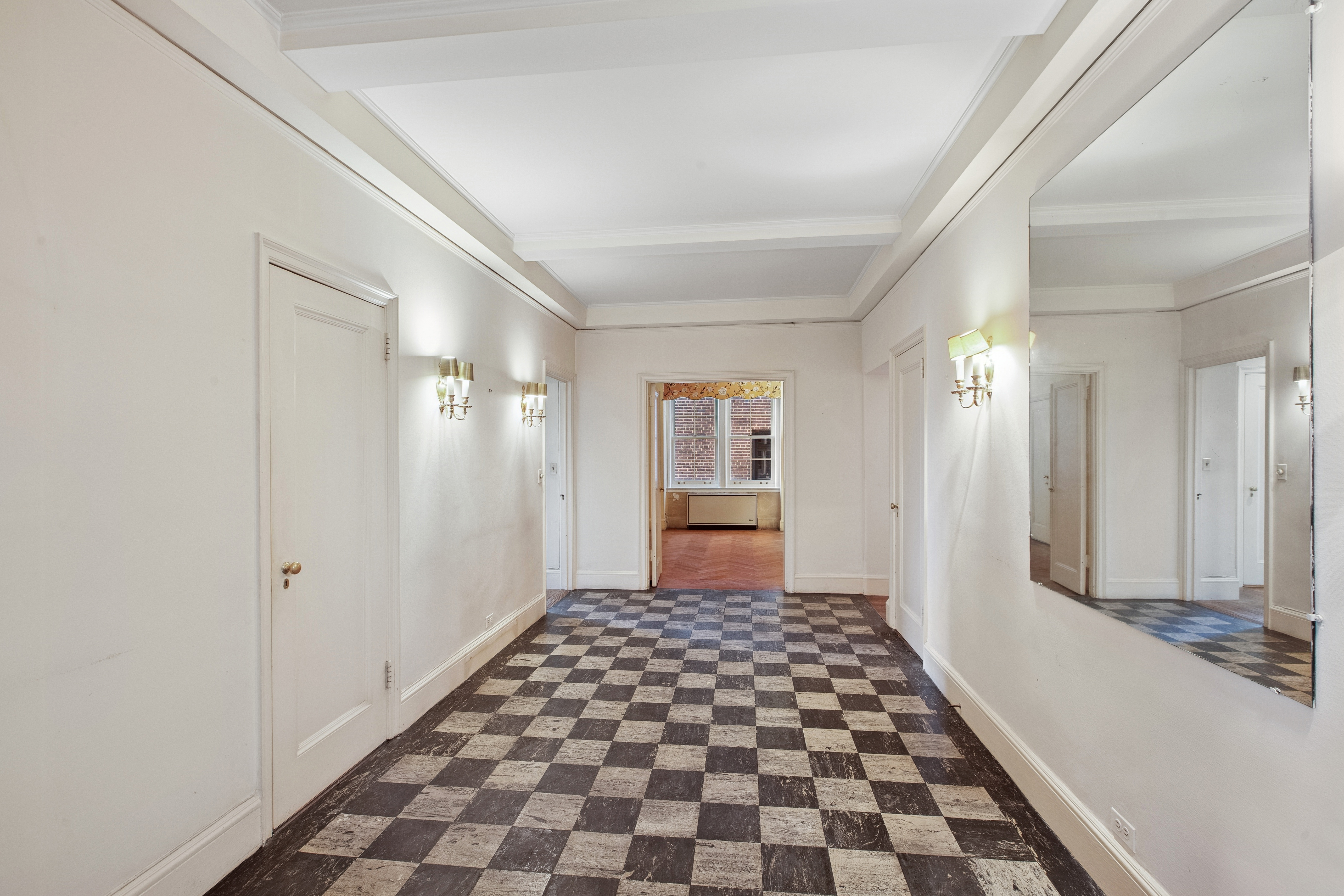 1170 5th Avenue, Unit 6A Manhattan, NY 10029 - Photo 9 of 17 a view of a bathroom with a black and white checkered floor