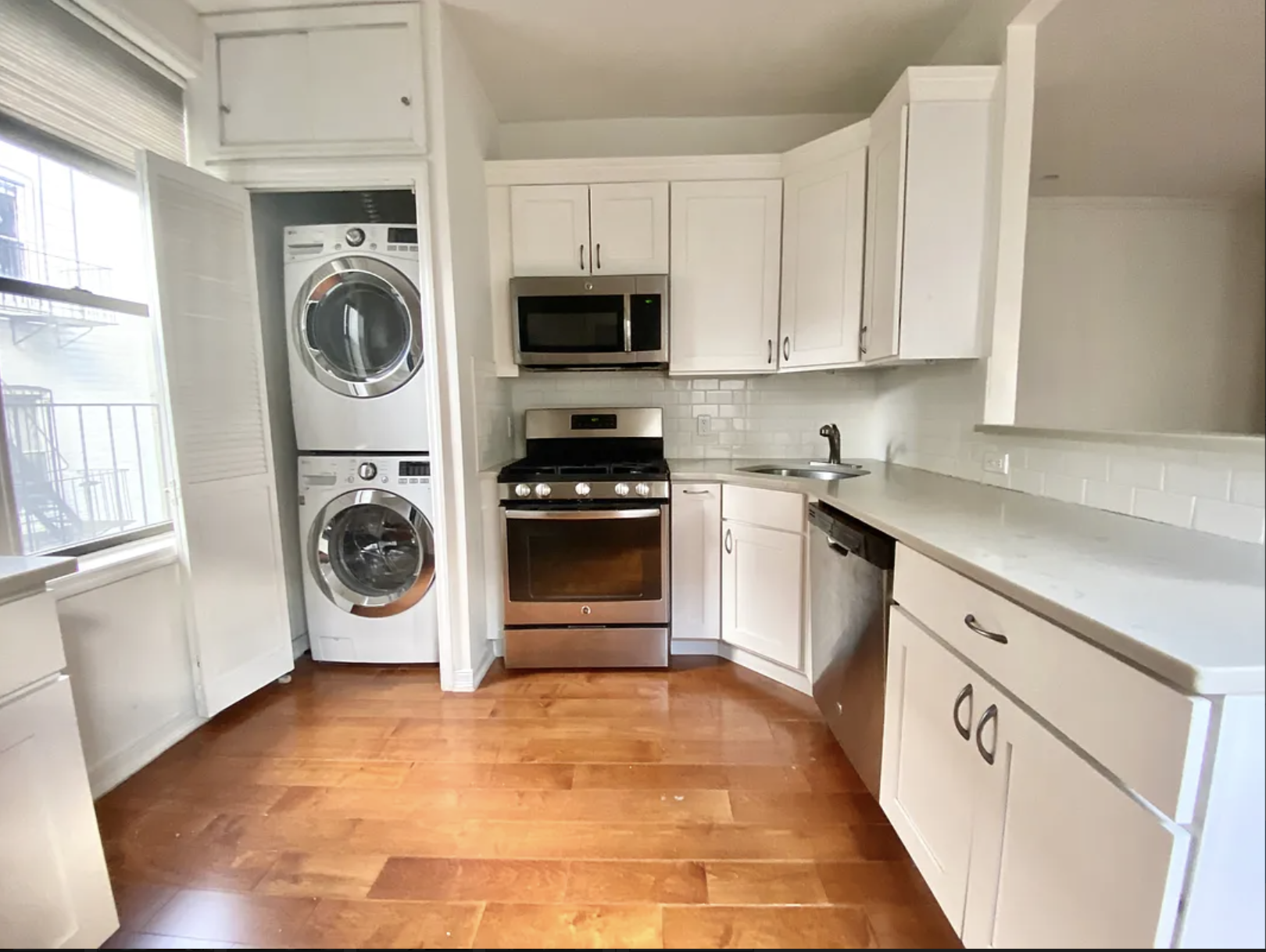 a view of a kitchen with washer and dryer