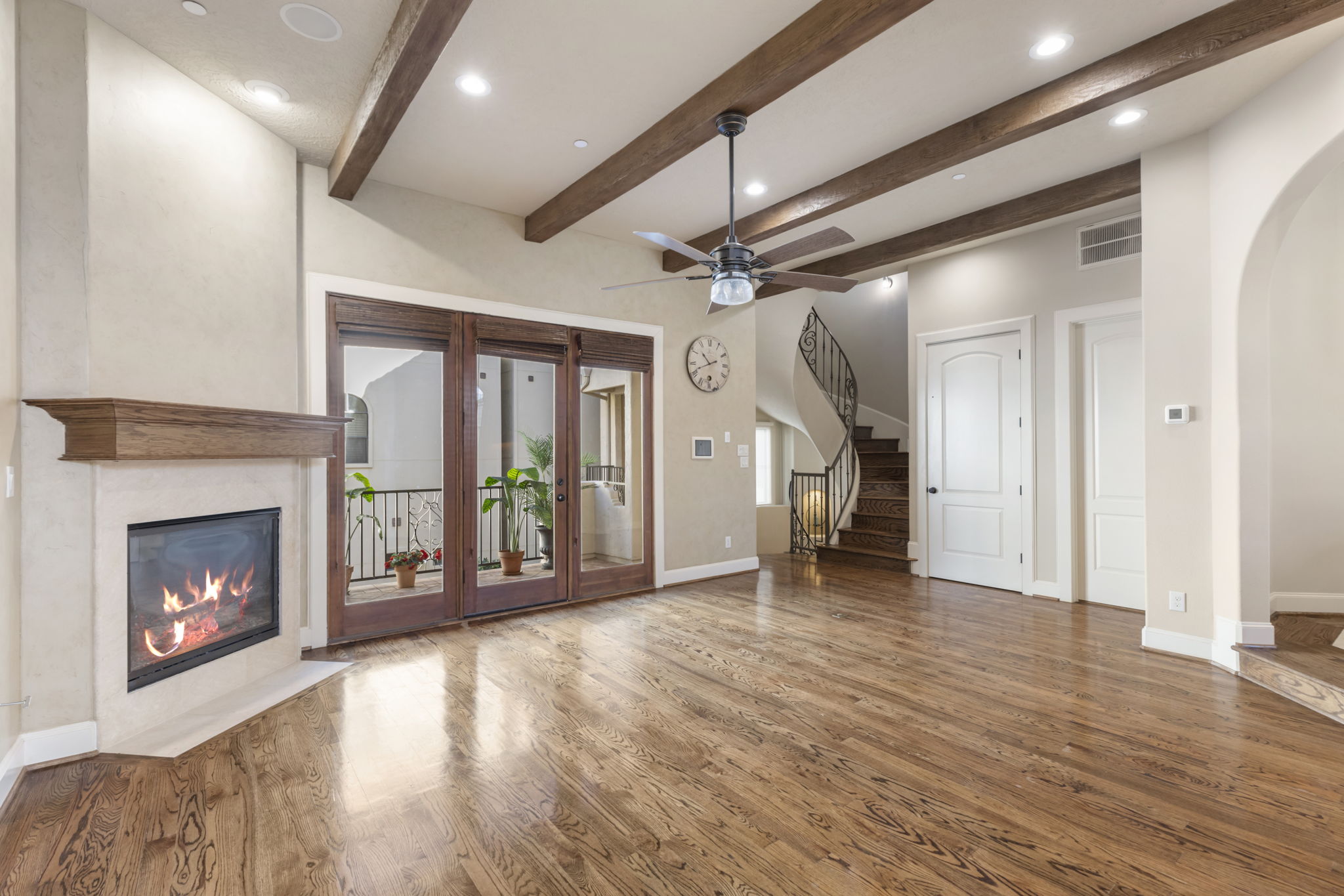 5407 Feagan Street Houston, TX 77007 - Photo 8 of 43 a view of an empty room with wooden floor fireplace and a window