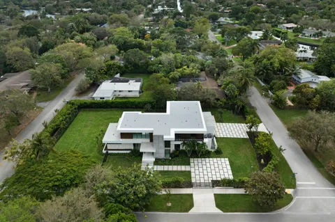 an aerial view of a house with a garden