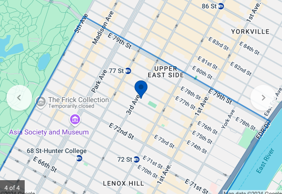 1315 3rd Avenue, Unit 2FN Manhattan, NY 10021 - Photo 2 of 4 a book on a bed next to a white wall