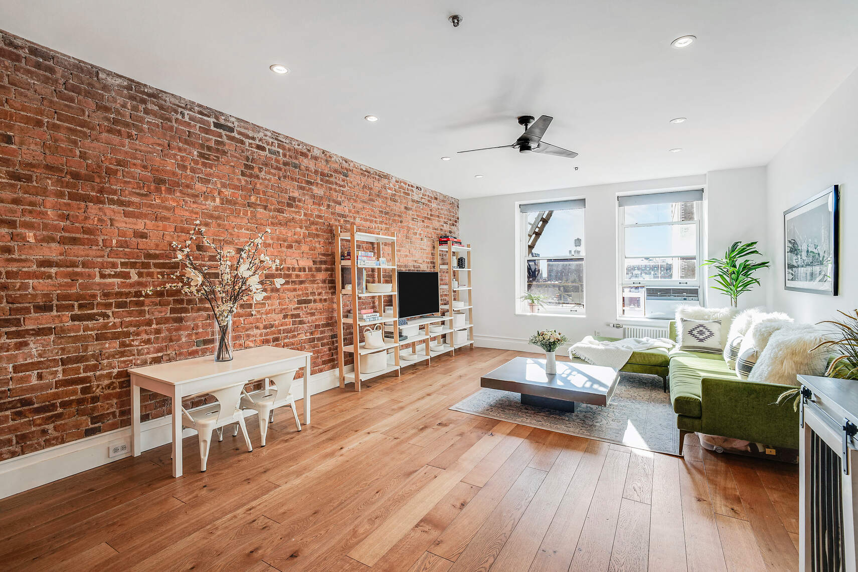 60 Pineapple Street, Unit 7I Brooklyn, NY 11201 - Photo 2 of 14 a living room with furniture and wooden floor