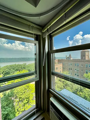 900 West 190th Street, Unit 9B Manhattan, NY 10040 - Photo 13 of 16 a view of a room with wooden floor