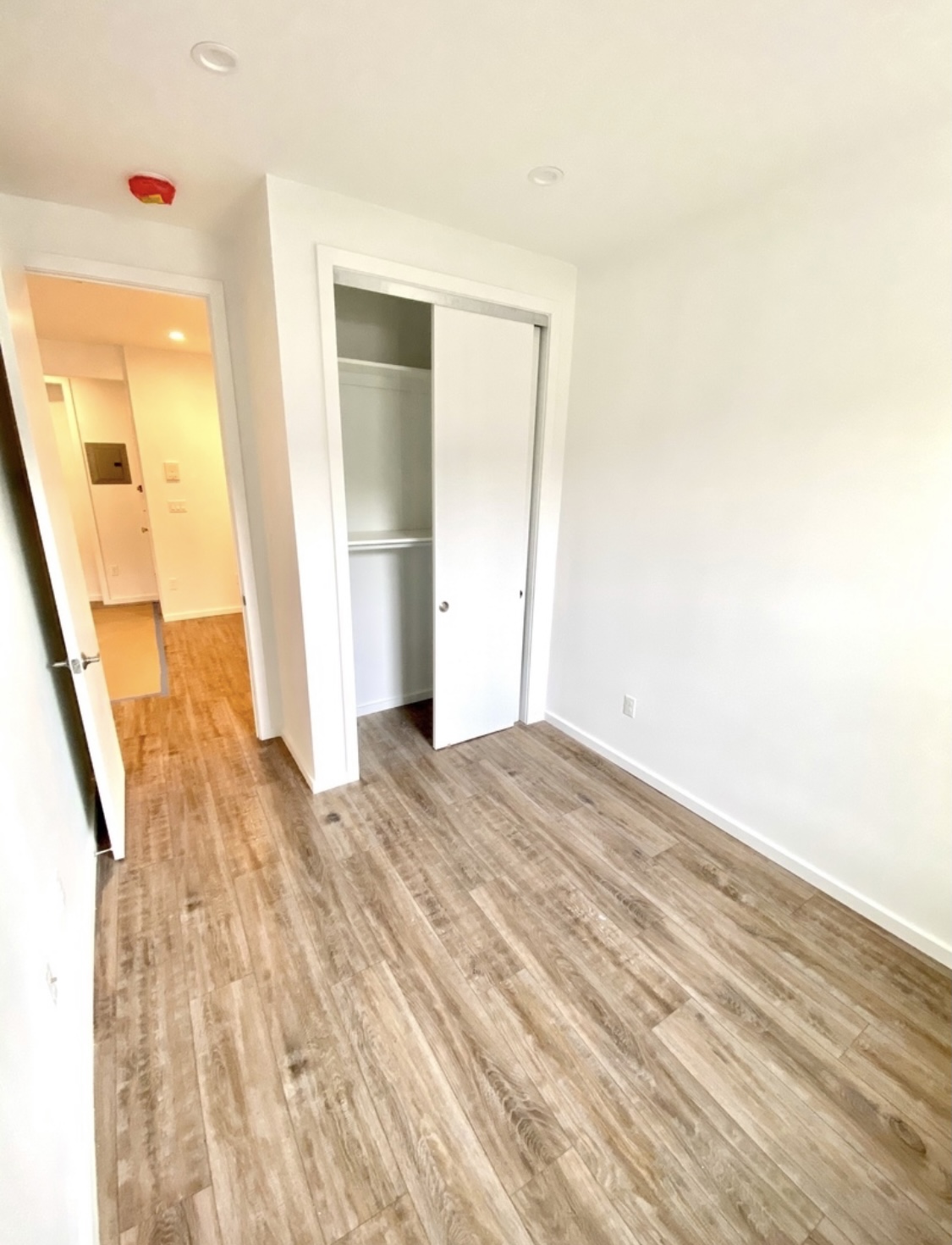 31-14 36th Street, Unit 3F Queens, NY 11106 - Photo 10 of 11 a view of hallway with wooden floor