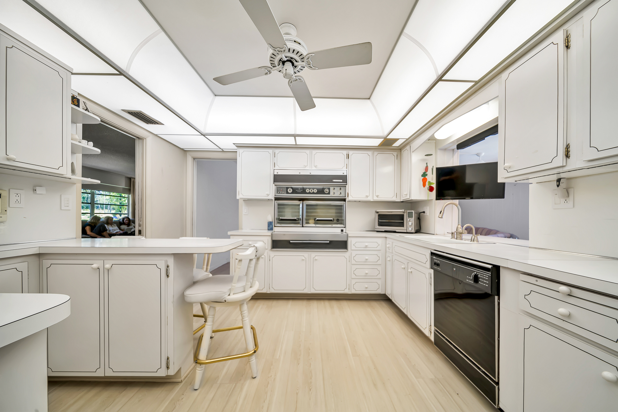 6760 Southwest 62nd Terrace Miami, FL 33143 - Photo 25 of 38 a kitchen with white cabinets and white appliances