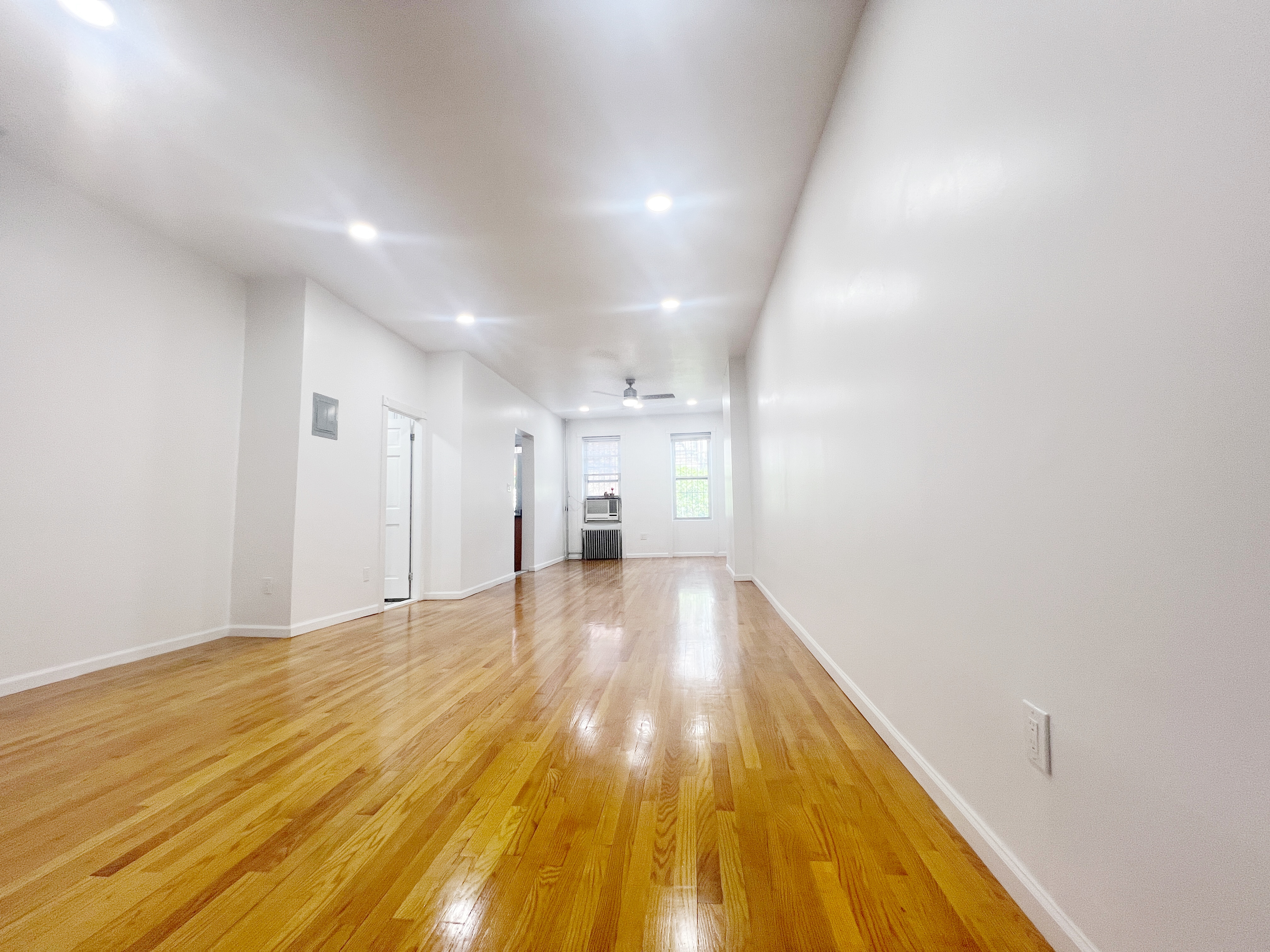 17-22 Menahan Street, Unit 1 Queens, NY 11385 - Photo 2 of 9 a view of empty room with wooden floor