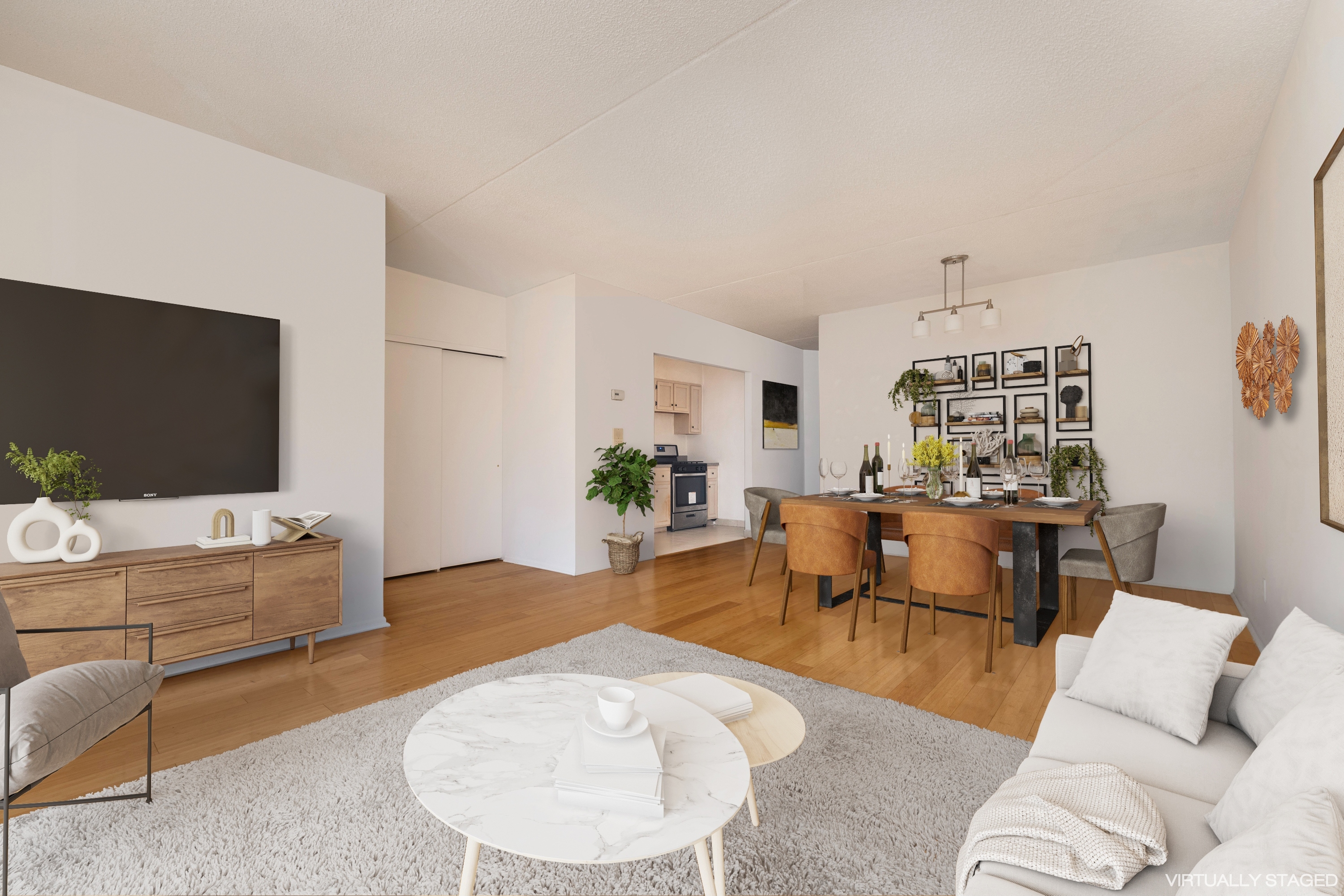 125 West 117th Street Manhattan, NY 10026 - Photo 14 of 23 a living room with furniture and a flat screen tv