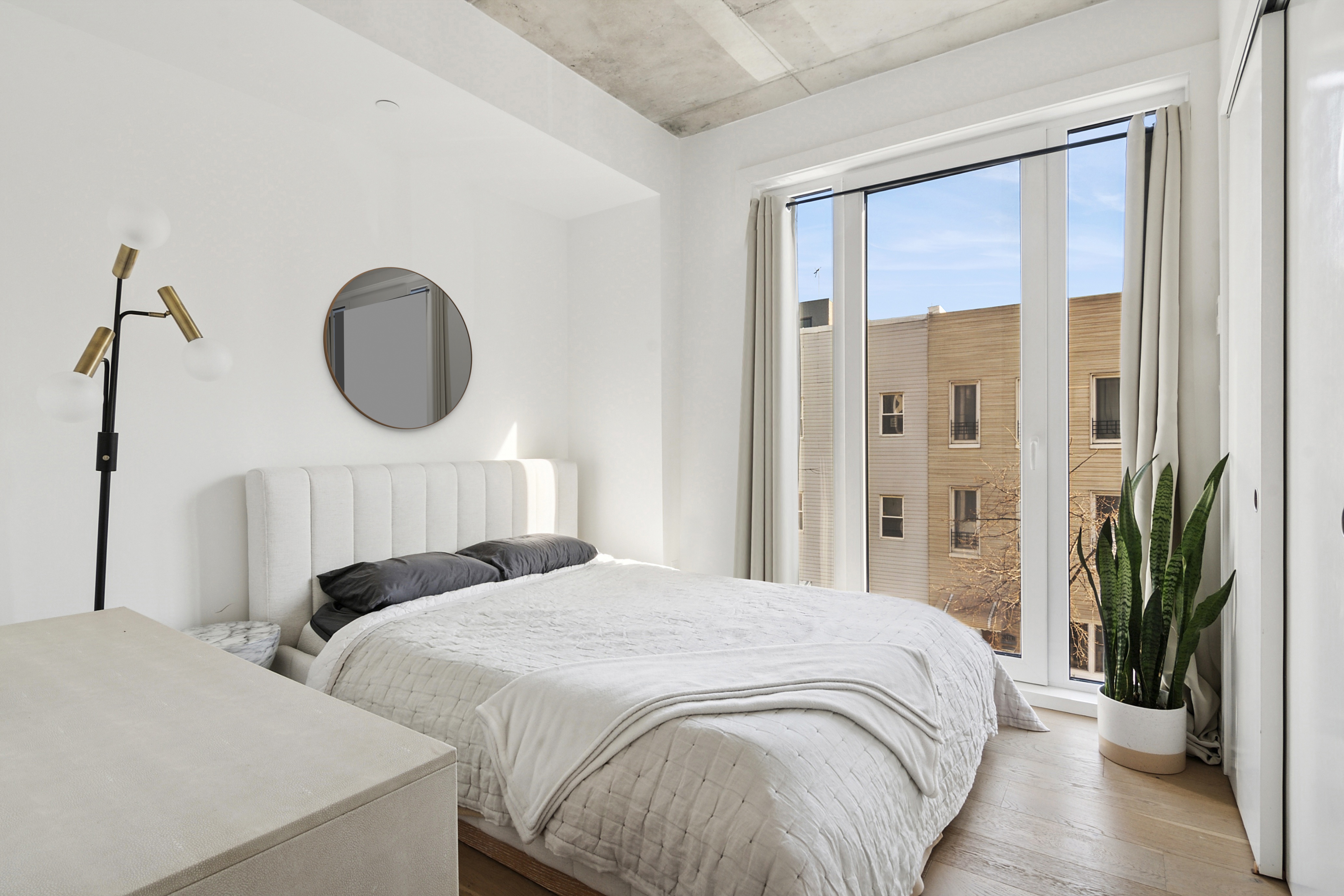 169 Huron Street, Unit 3A Brooklyn, NY 11222 - Photo 4 of 7 a bedroom with a bed and a large window