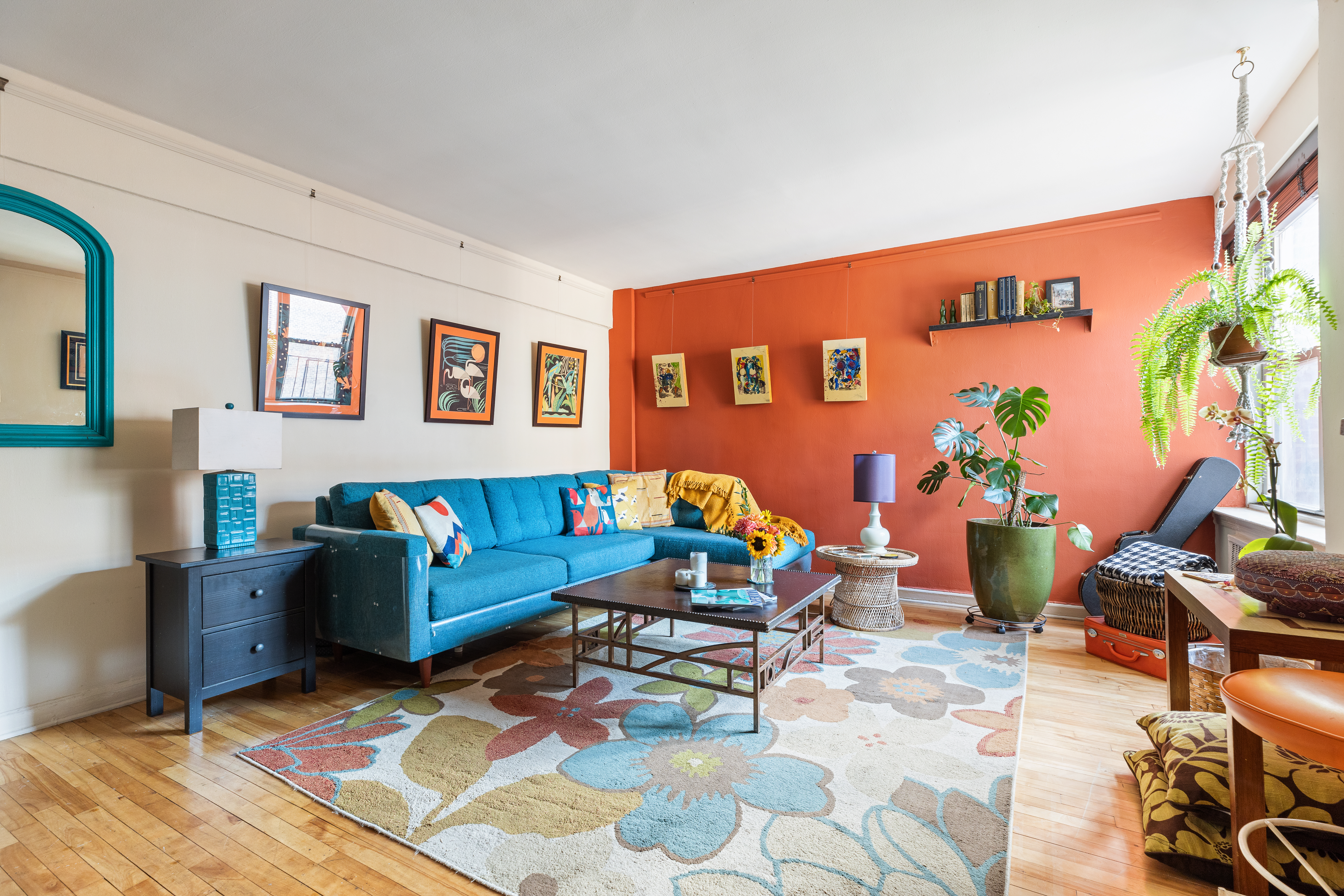 a living room with furniture a rug and a table