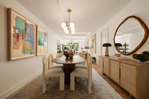a view of a dining room with furniture window and a chandelier