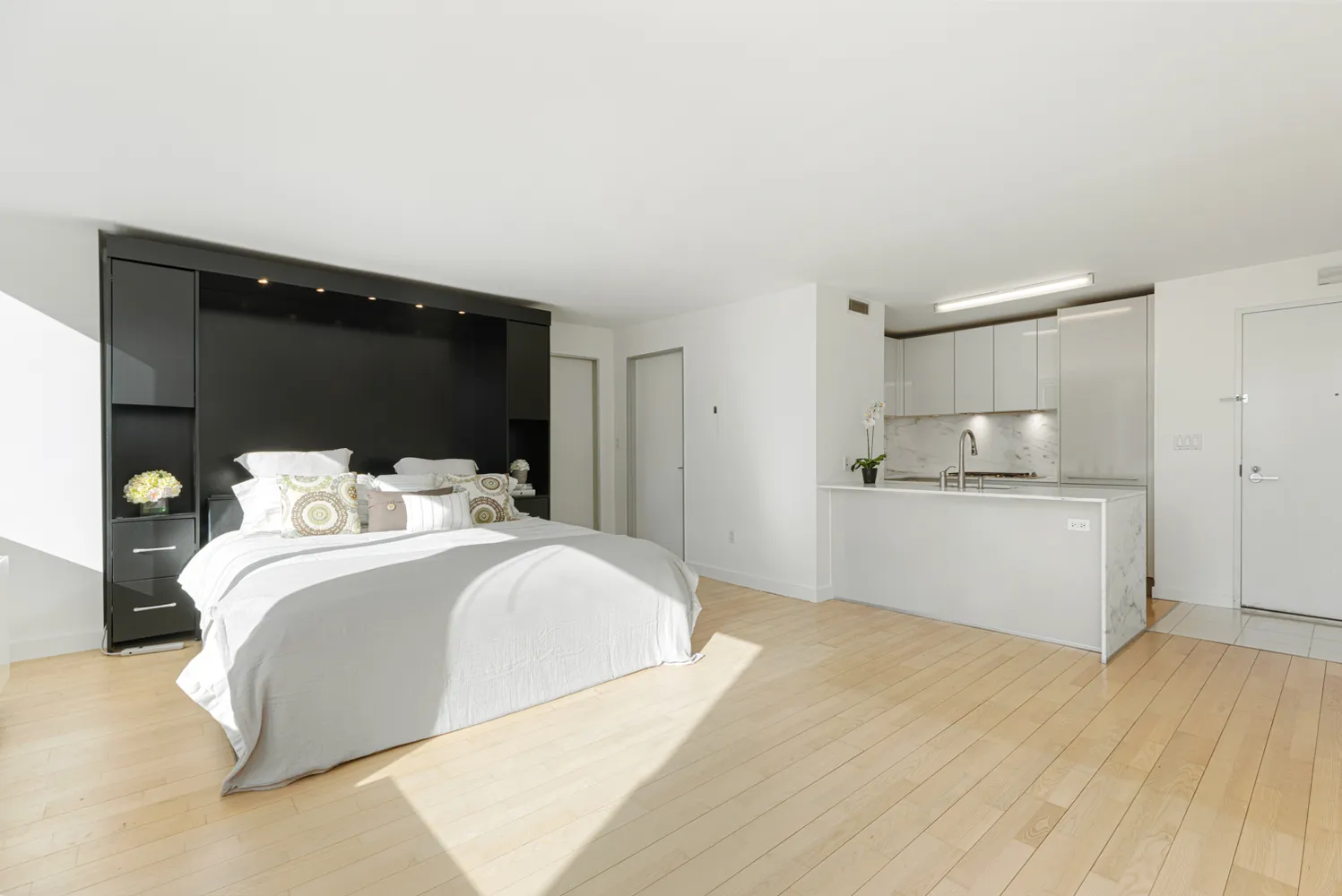 a spacious bedroom with a bed and window