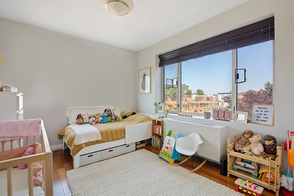 30-85 Vernon Boulevard, Unit 3M Queens, NY 11102 - Photo 5 of 8 a bedroom with furniture and a large window