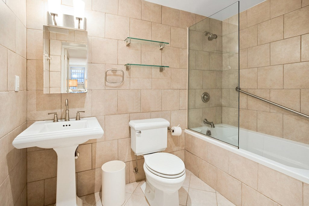 315 Washington Avenue Brooklyn, NY 11205 - Photo 36 of 38 a bathroom with a sink toilet and shower