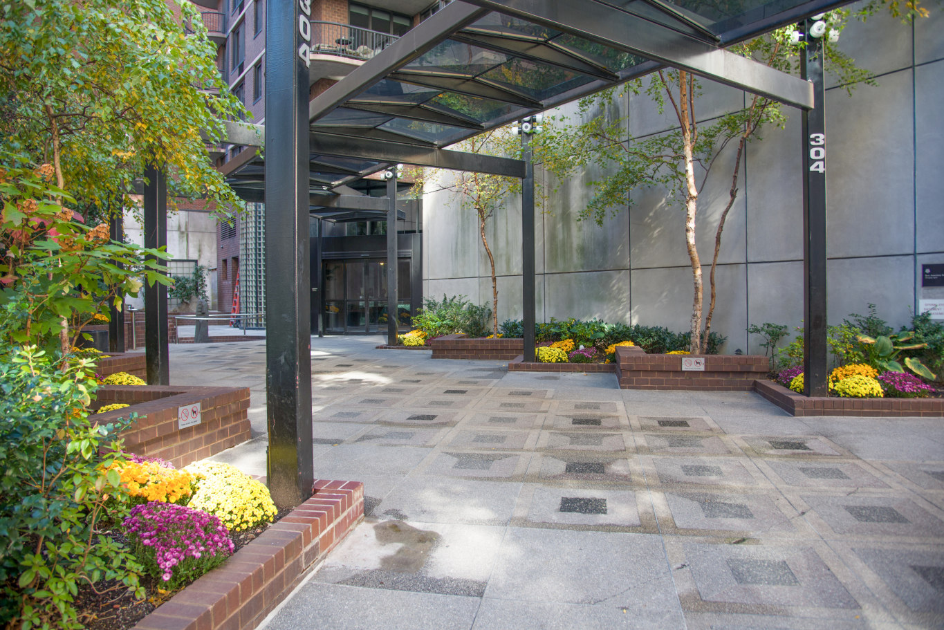 304 East 65th Street, Unit 14D Manhattan, NY 10065 - Photo 11 of 14 a view of yard with an outdoor seating