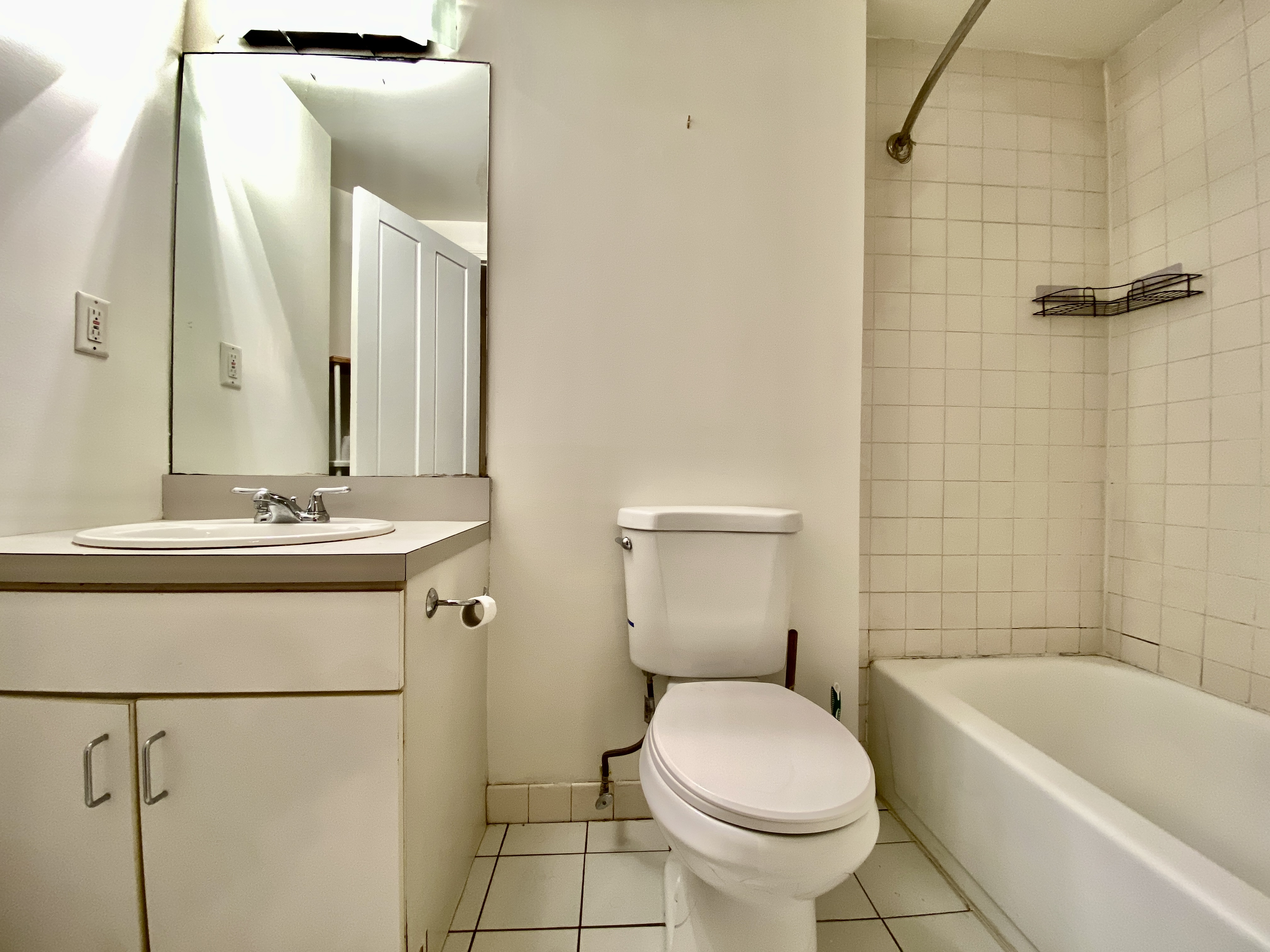119 Gates Avenue, Unit 1 Brooklyn, NY 11238 - Photo 7 of 11 a bathroom with a sink toilet and shower