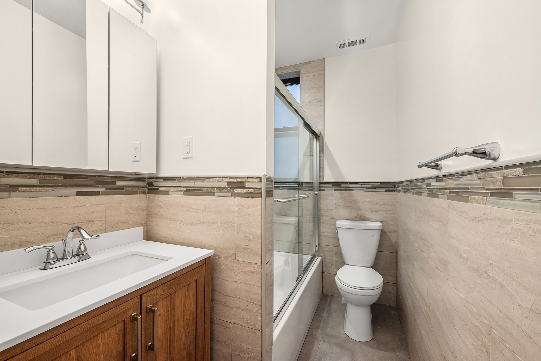 334 West 85th Street, Unit 3A Manhattan, NY 10024 - Photo 7 of 8 a bathroom with a toilet a sink and mirror