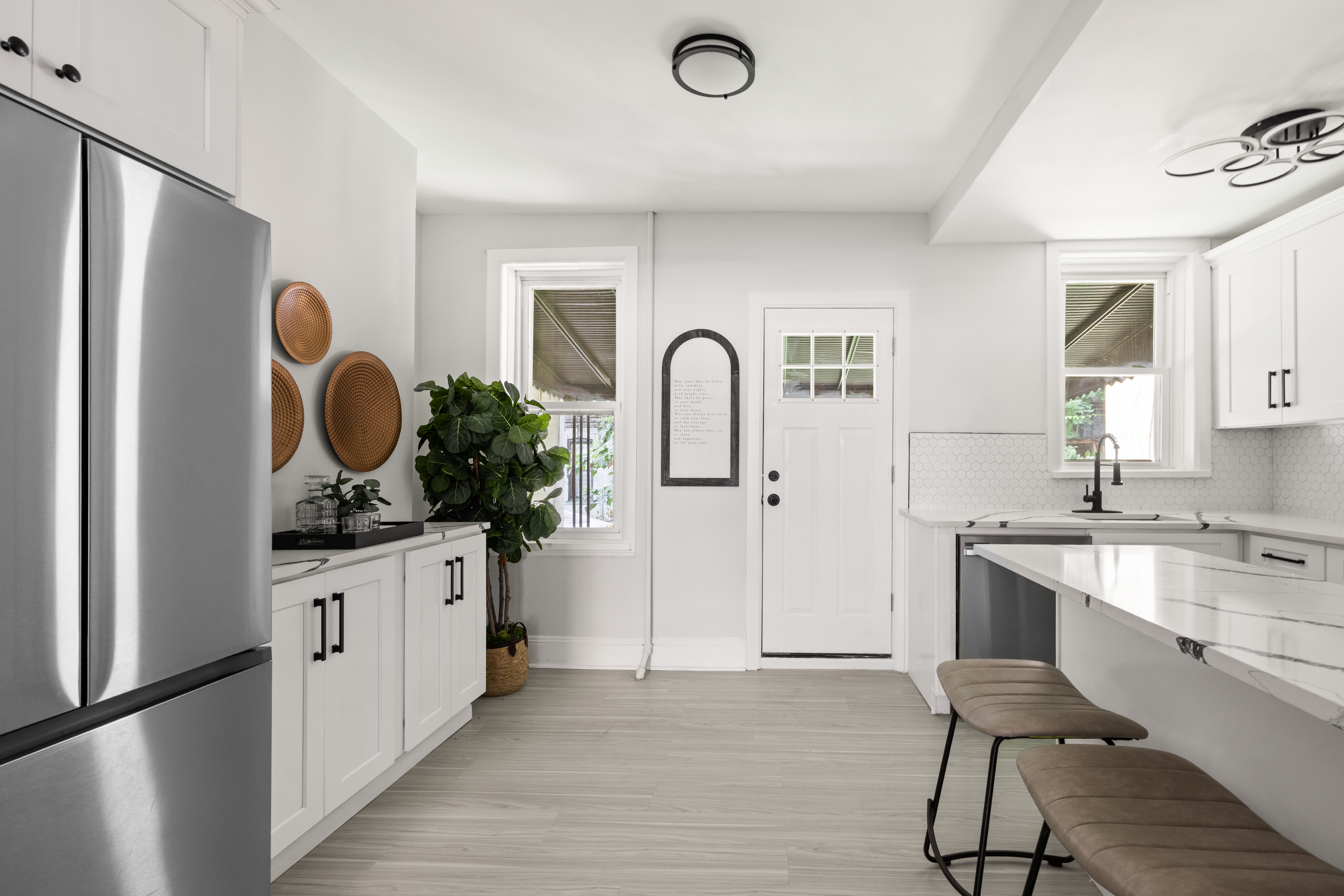 1588 Lincoln Place Brooklyn, NY 11233 - Photo 3 of 12 a kitchen with white cabinets and sink