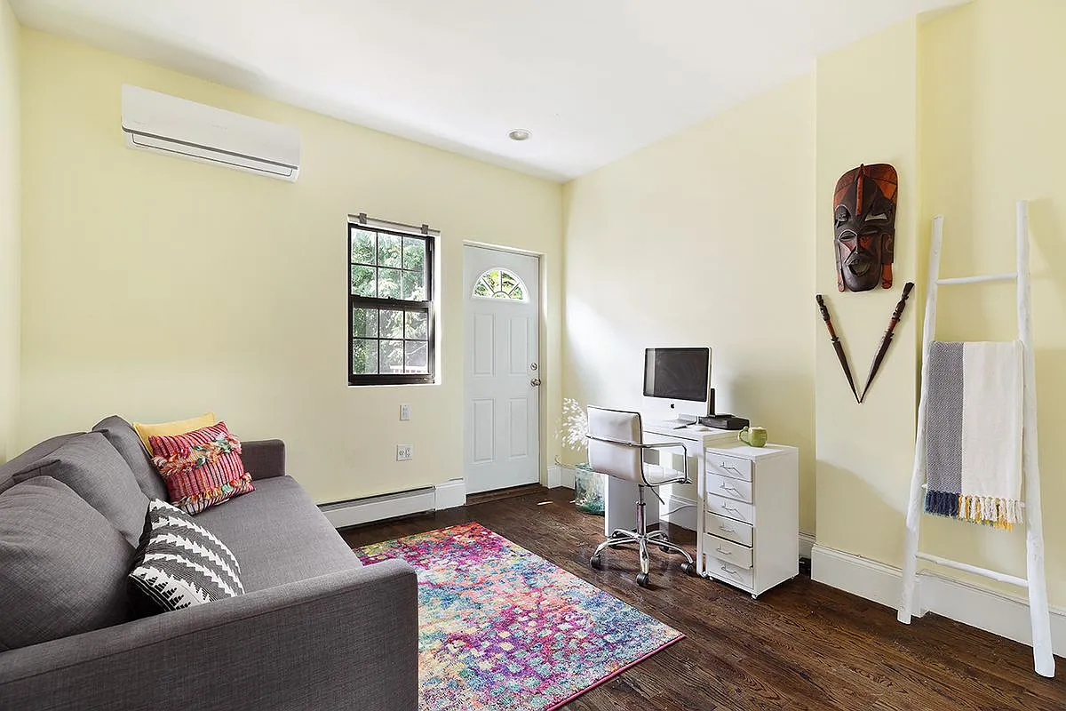 96 Sackman Street Brooklyn, NY 11233 - Photo 7 of 10 a living room with furniture and a wooden floor