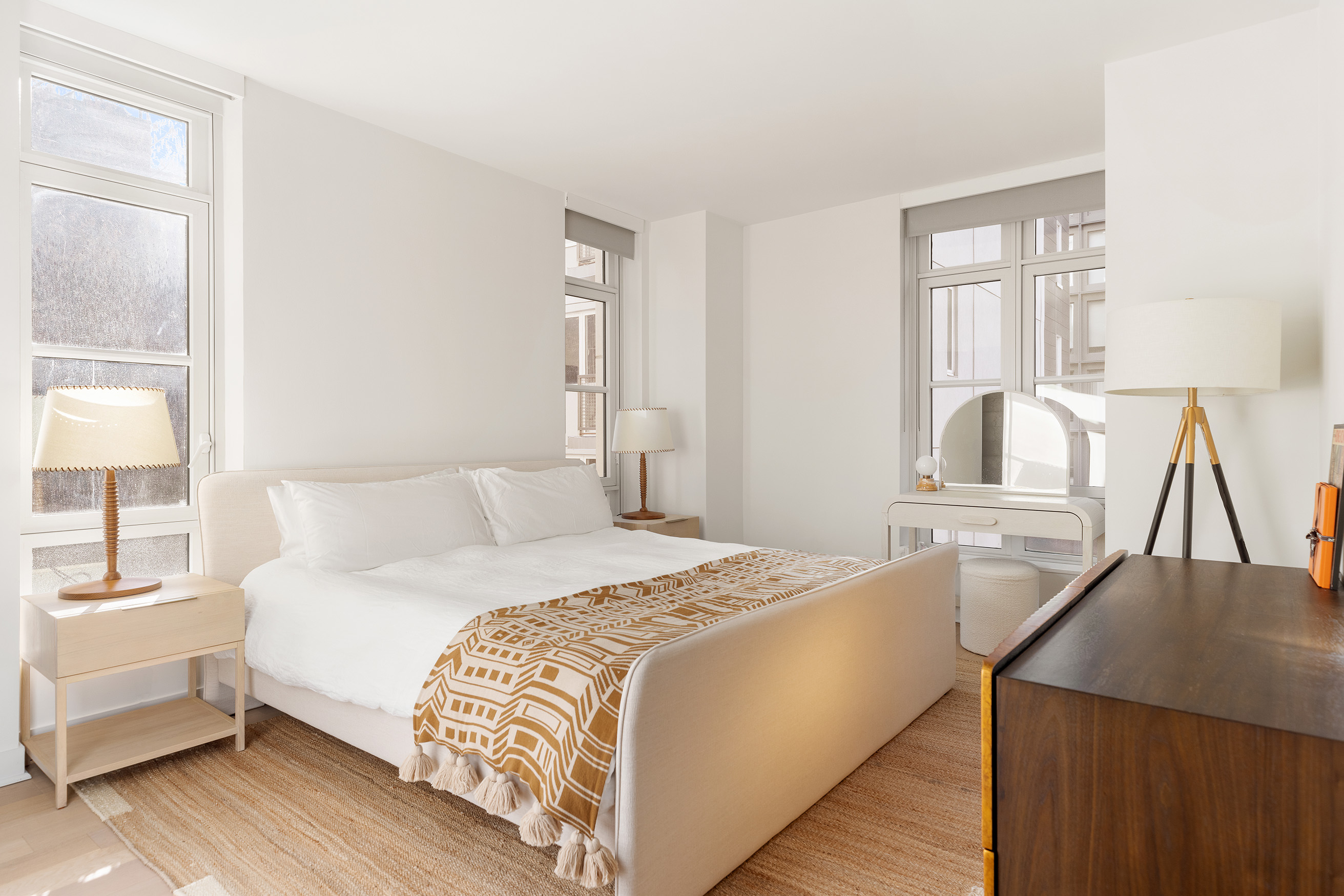 261 Hudson Street, Unit 5S Manhattan, NY 10013 - Photo 4 of 6 a bedroom with a bed and a large window