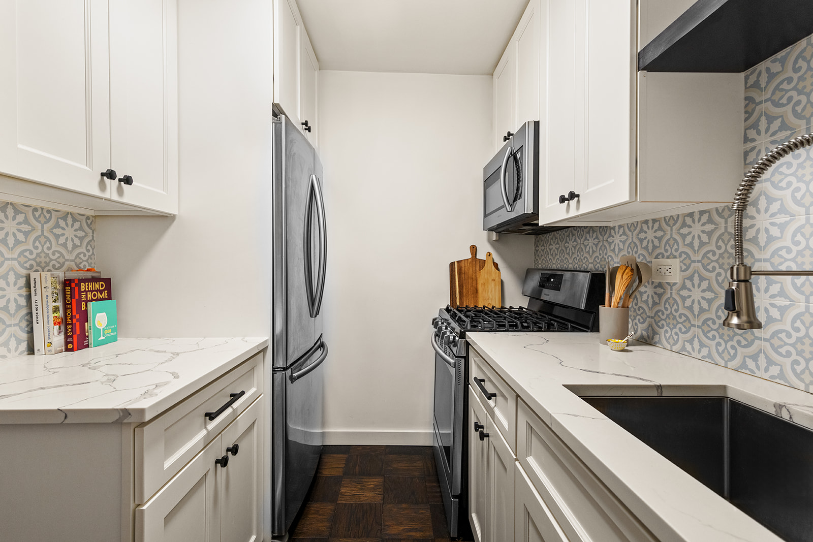 333 East 79th Street, Unit 1R Manhattan, NY 10075 - Photo 5 of 12 a kitchen with stainless steel appliances granite countertop a sink stove and refrigerator