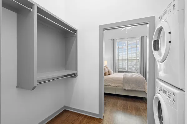 a bedroom with a bed and a mirror