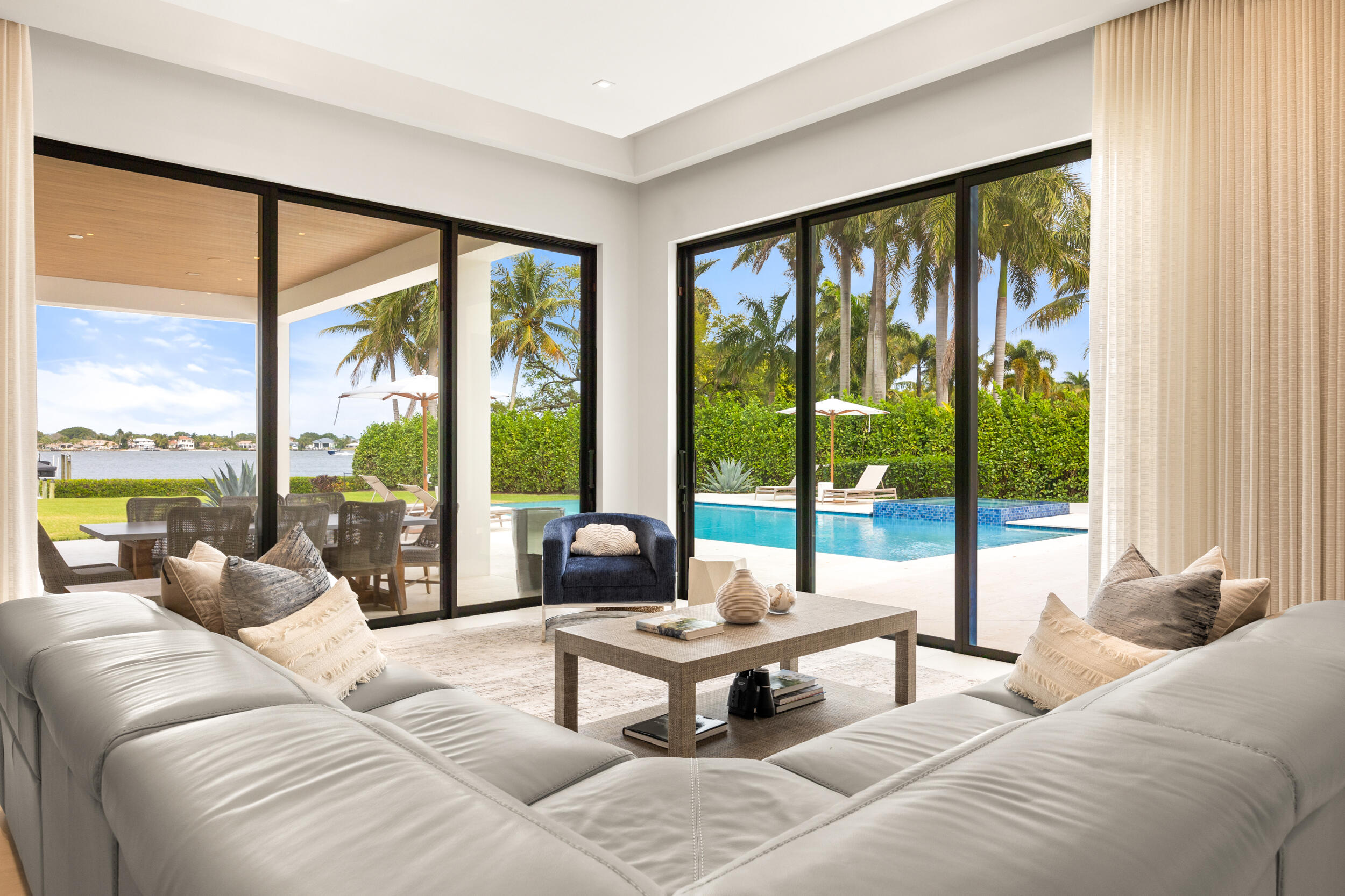 5695 Pennock Point Road Jupiter, FL 33458 - Photo 41 of 77 a living room with furniture and a large window