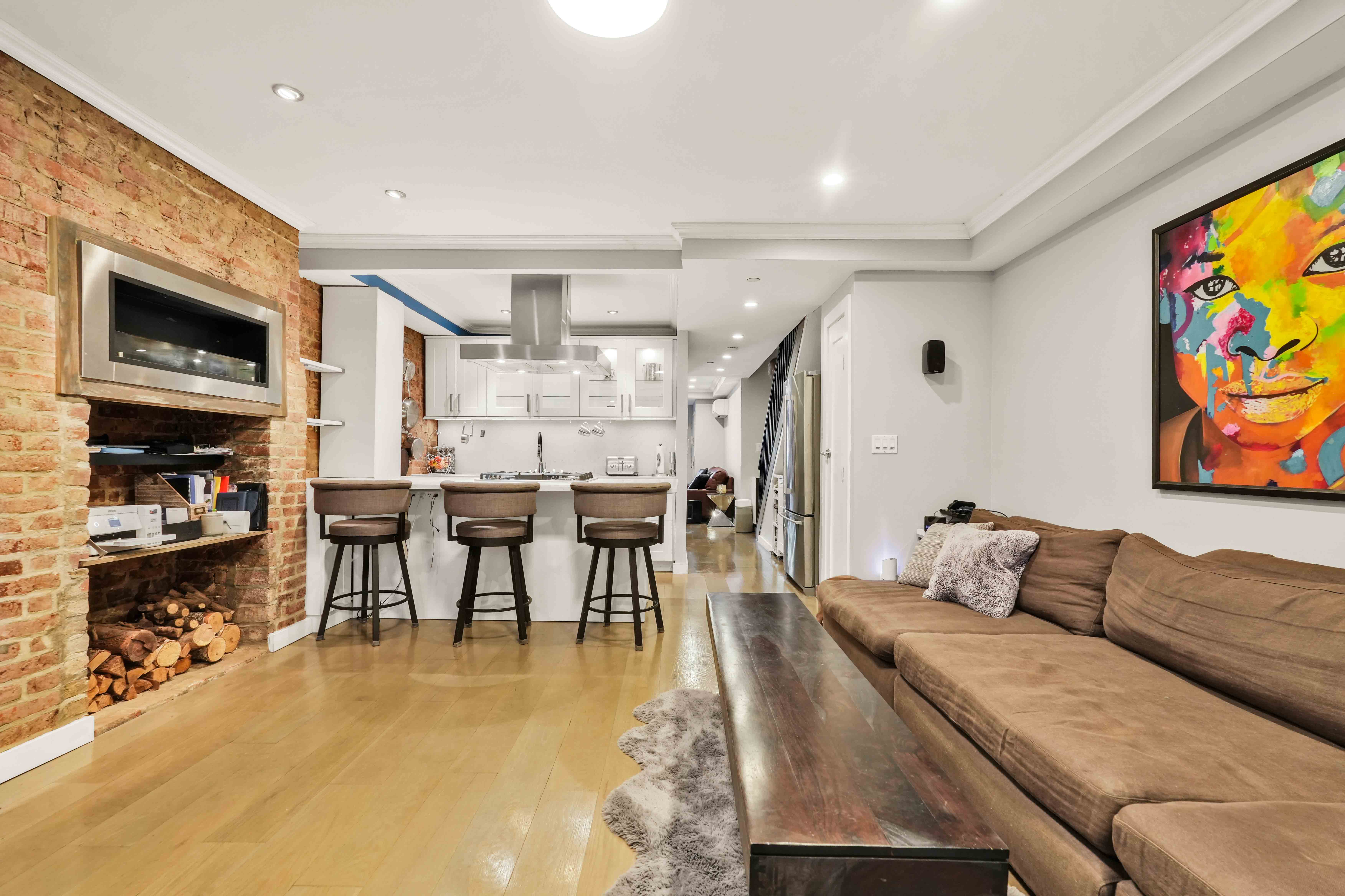 288 St James Place, Unit TRIPLEX Brooklyn, NY 11238 - Photo 2 of 25 a living room with furniture and a flat screen tv