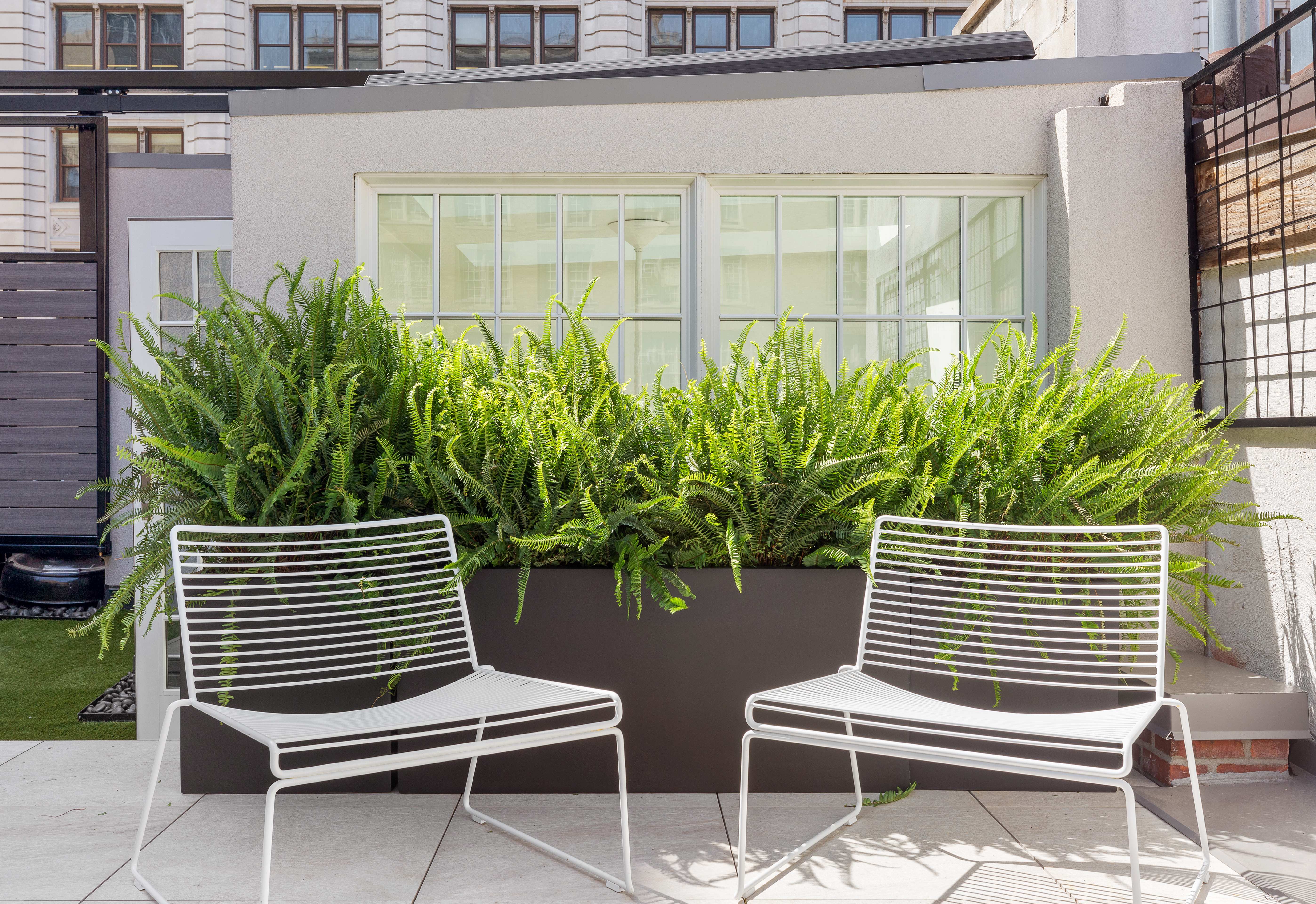 137 East 15th Street, Unit 2B Manhattan, NY 10003 - Photo 2 of 2 a view of a chair and table in the back yard of a house