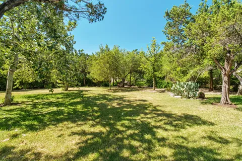 a view of swimming pool with trees