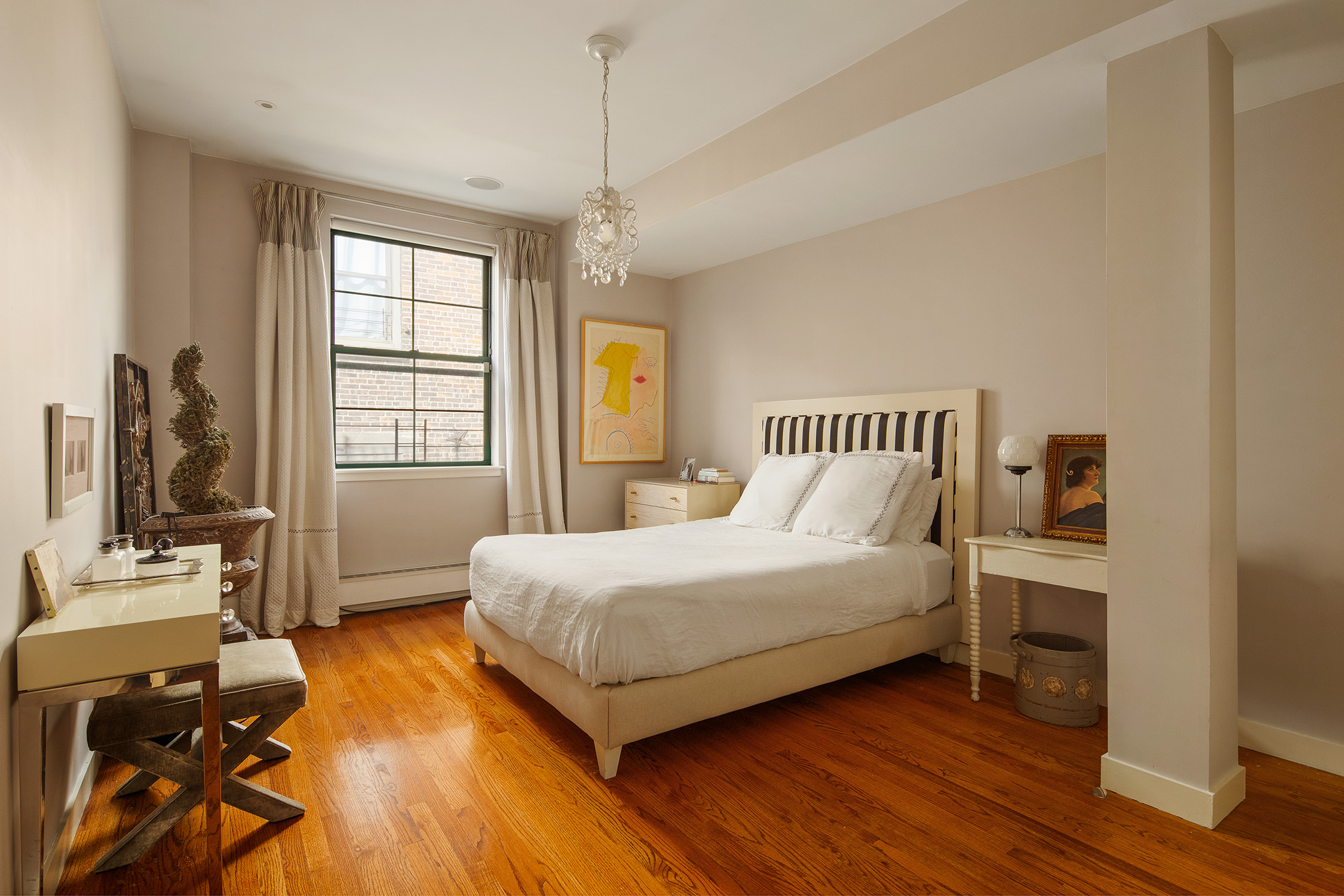 152 Franklin Street, Unit PH Manhattan, NY 10013 - Photo 13 of 17 a bedroom with a bed and wooden floor