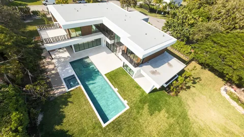 aerial view of a house with a yard