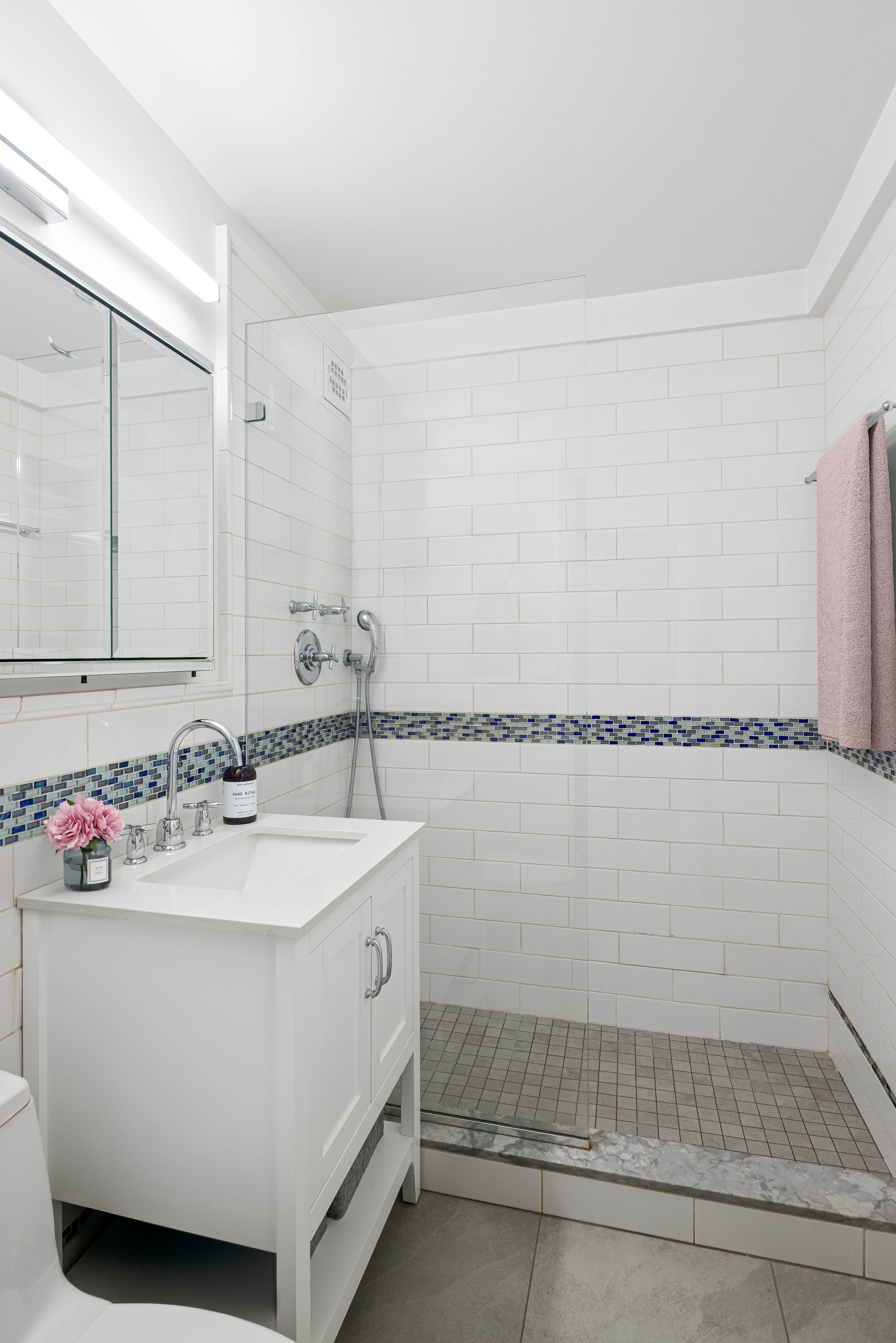 320 West 76th Street, Unit 6D Manhattan, NY 10023 - Photo 8 of 16 a bathroom with a sink and a mirror