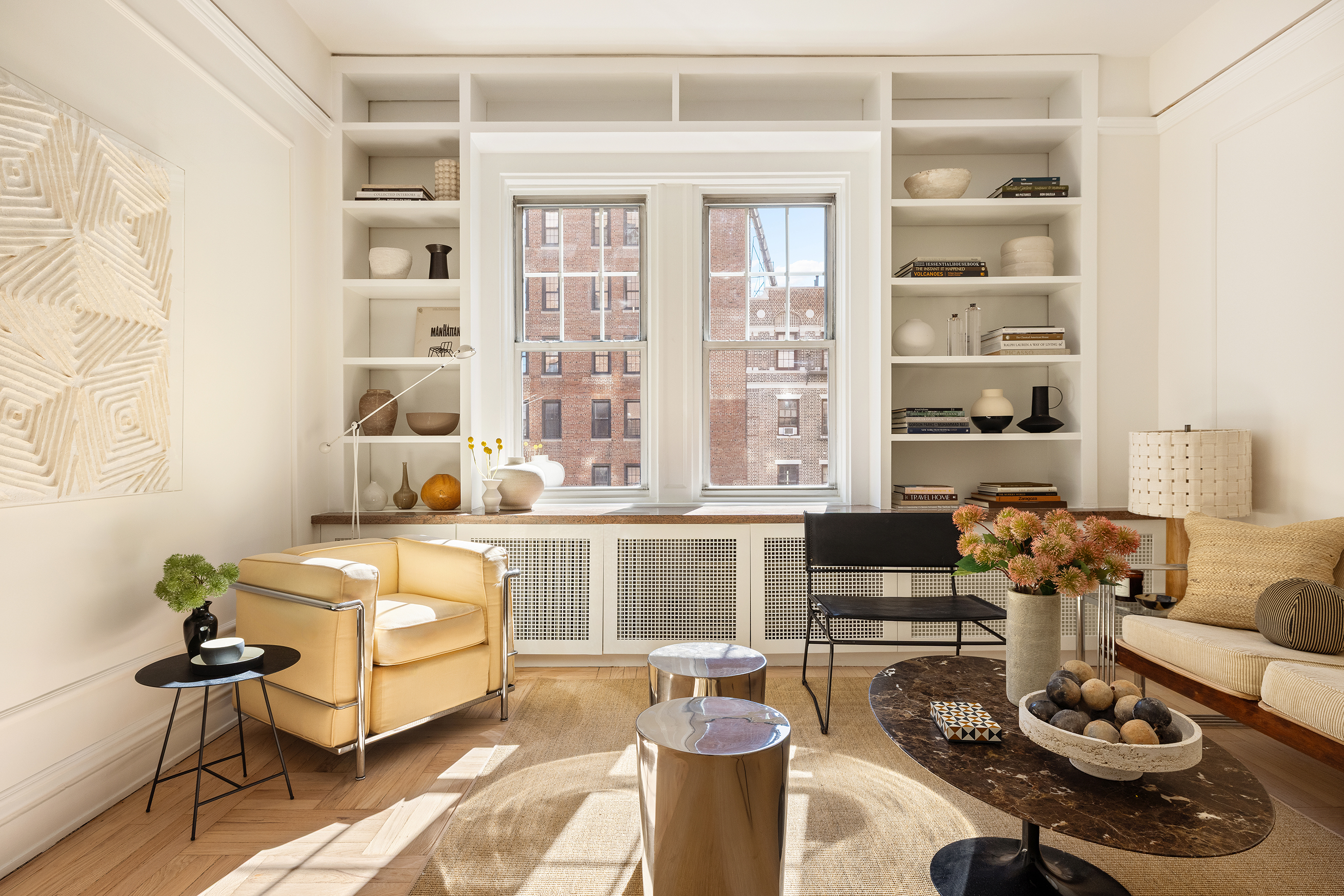 30 5th Avenue, Unit 6H Manhattan, NY 10011 - Photo 1 of 17 a living room with furniture a rug and a window