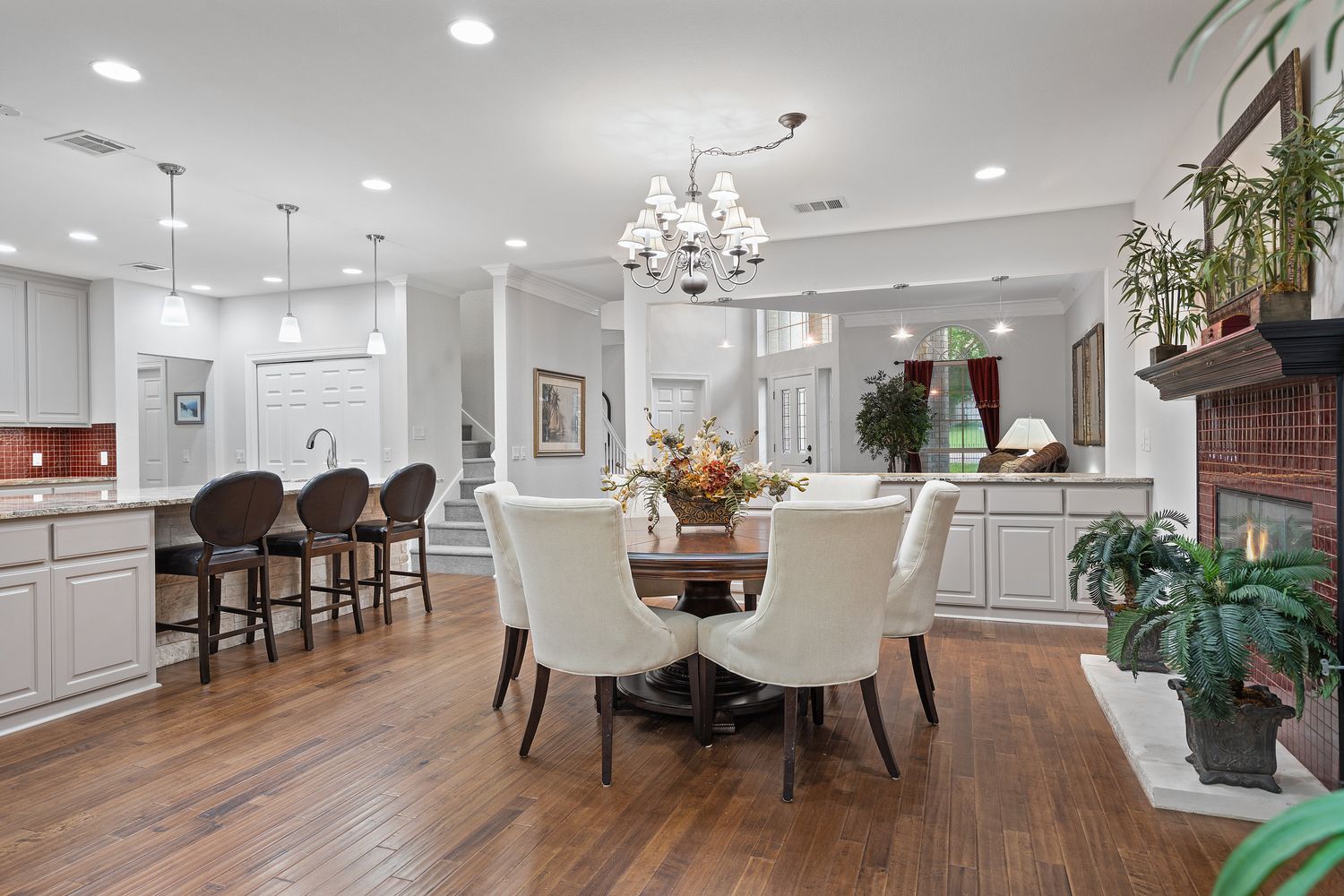 a view of a dining room with furniture and wooden floor