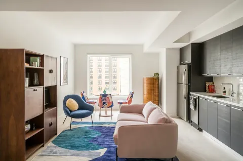 a living room with furniture and a large window