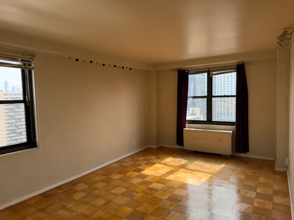 a view of an empty room and window