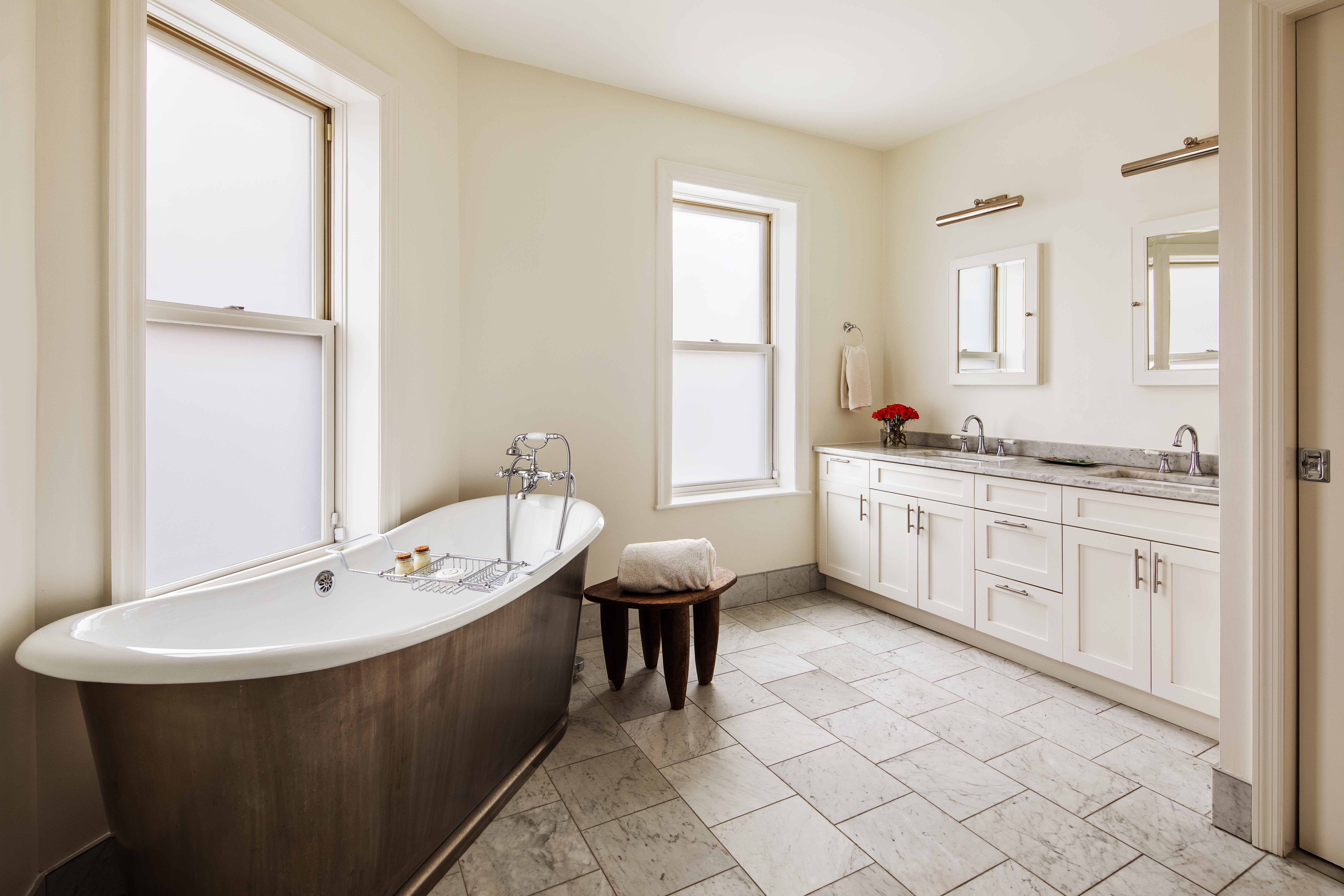 27 7th Avenue Brooklyn, NY 11217 - Photo 15 of 23 a spacious bathroom with a double vanity sink a mirror and a bathtub