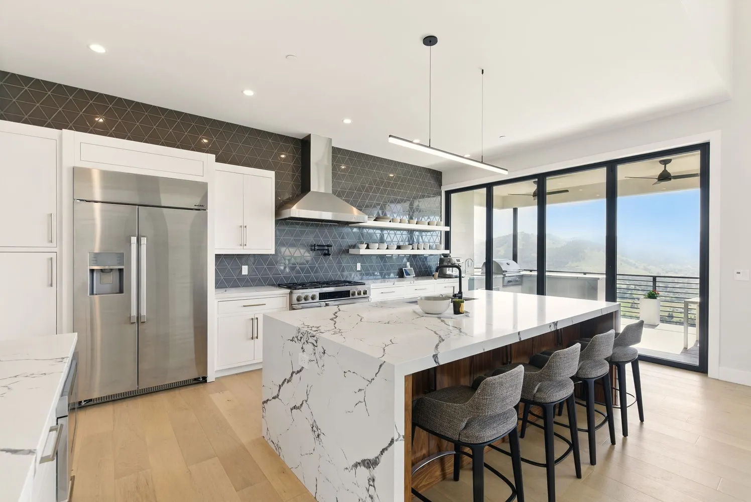 a kitchen with stainless steel appliances granite countertop a sink and a counter