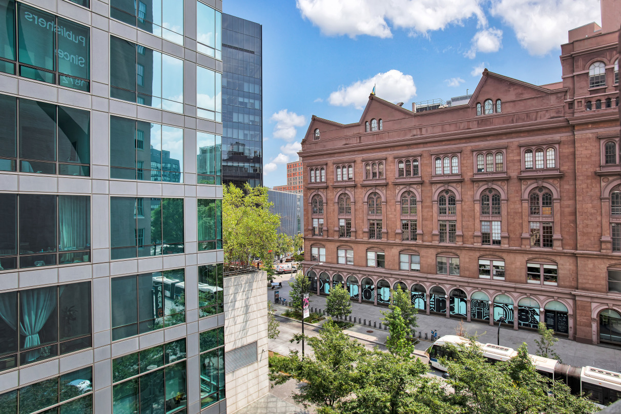 62 Cooper Square, Unit 4C Manhattan, NY 10003 - Photo 4 of 7 a large building with a lot of windows