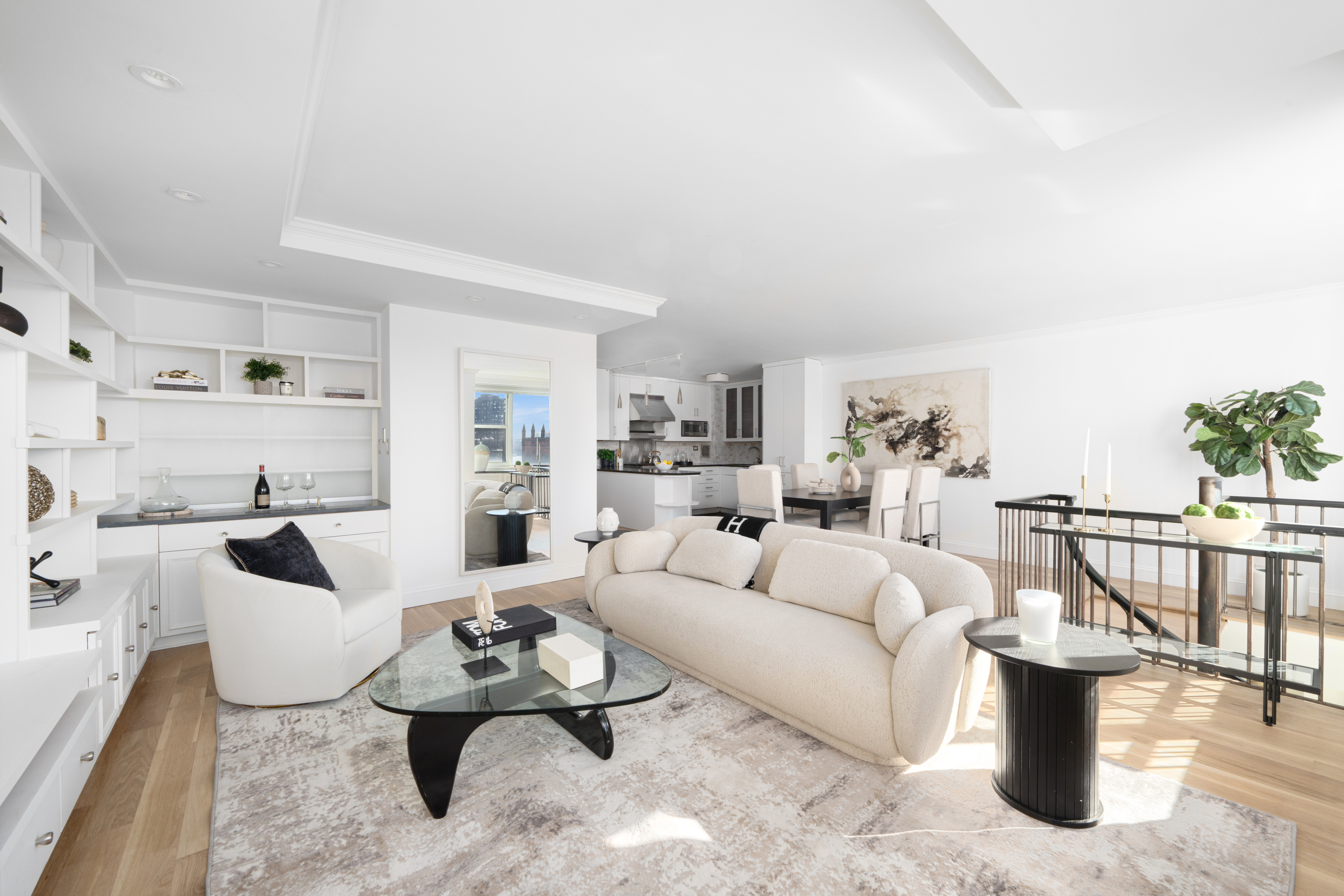 360 West 22nd Street, Unit 15C-14C Manhattan, NY 10011 - Photo 4 of 16 a living room with furniture white walls and white walls