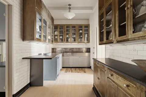 a kitchen with stainless steel appliances granite countertop a stove and a sink