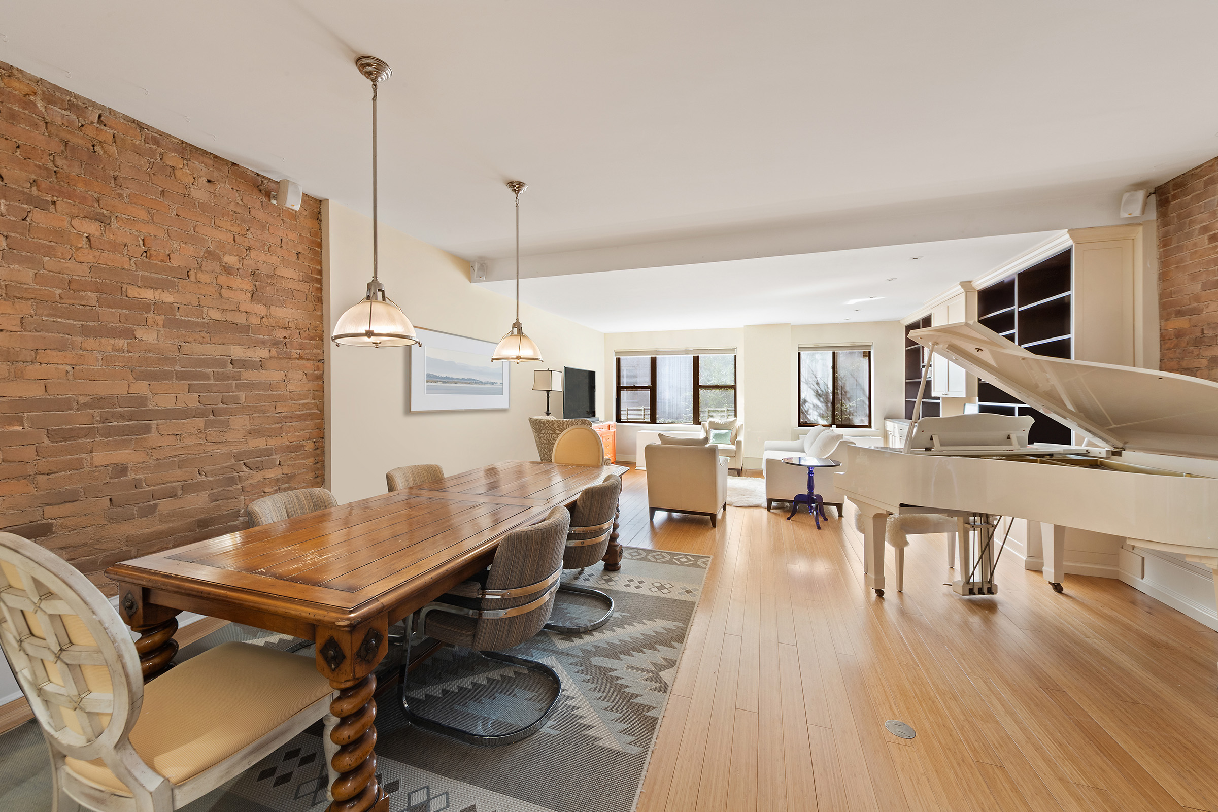 216 East 75th Street, Unit 3EAST Manhattan, NY 10021 - Photo 2 of 9 a living room with furniture pool table chairs and wooden floor