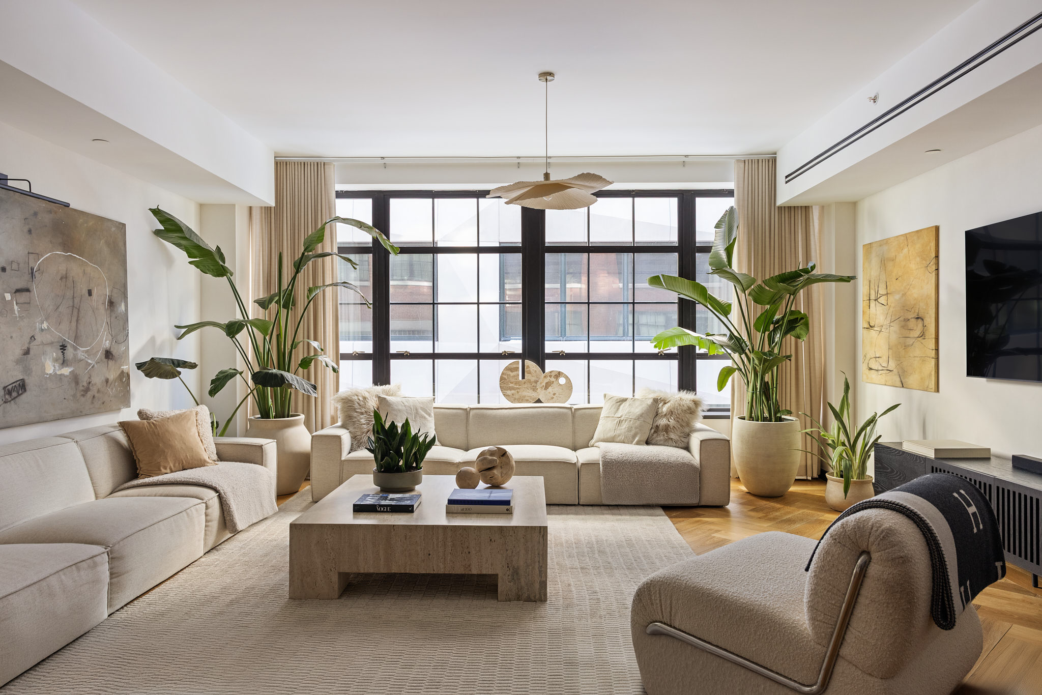 a living room with furniture fireplace and flat screen tv