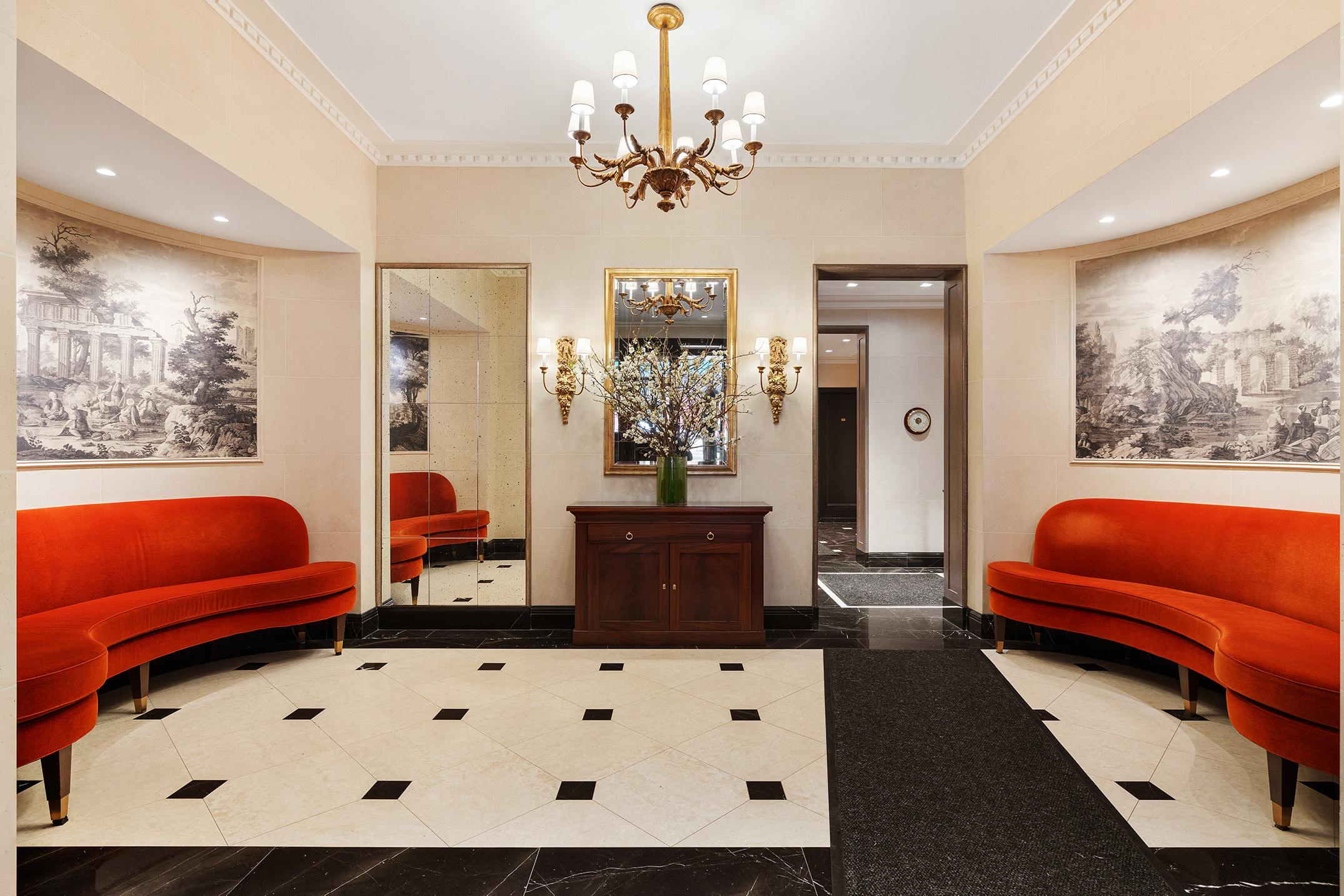 169 East 78th Street, Unit 5D Manhattan, NY 10075 - Photo 12 of 15 a living room with furniture and a chandelier