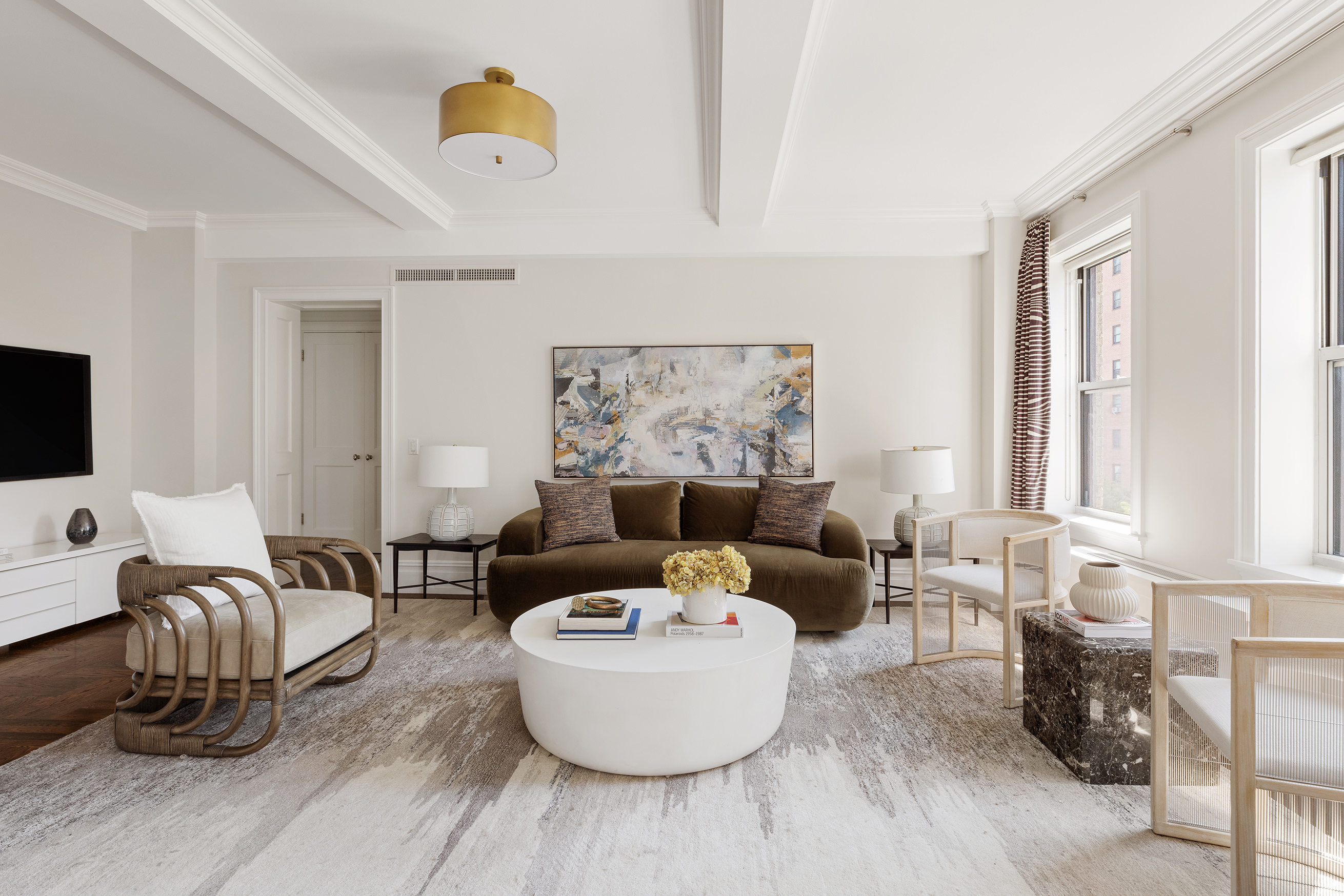 165 West 91st Street, Unit 9AB Manhattan, NY 10024 - Photo 2 of 24 a living room with furniture and a flat screen tv