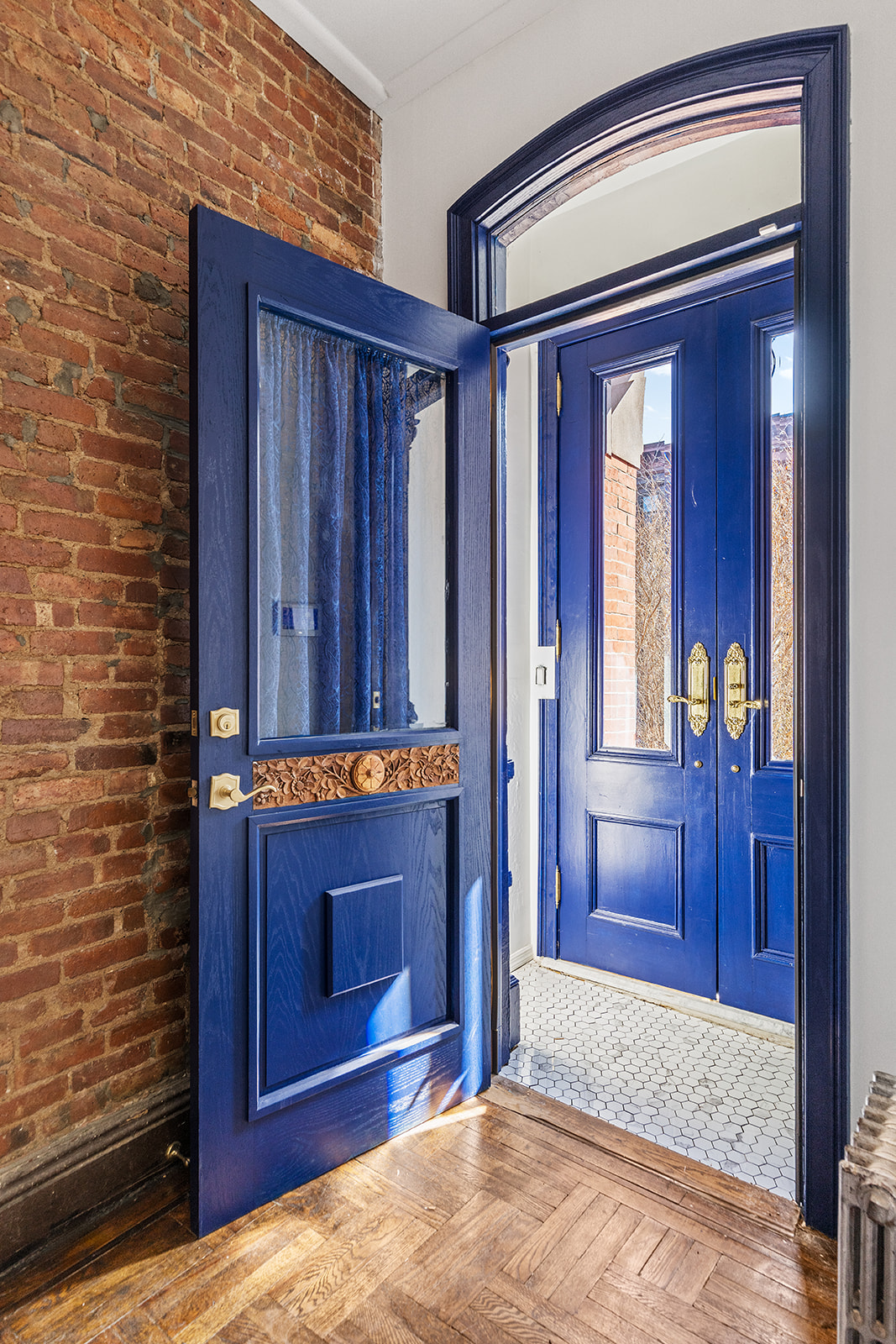 231 Vernon Avenue Brooklyn, NY 11206 - Photo 10 of 13 a view of front door with furniture
