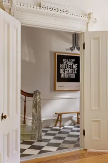 a kitchen with a table and chairs in it